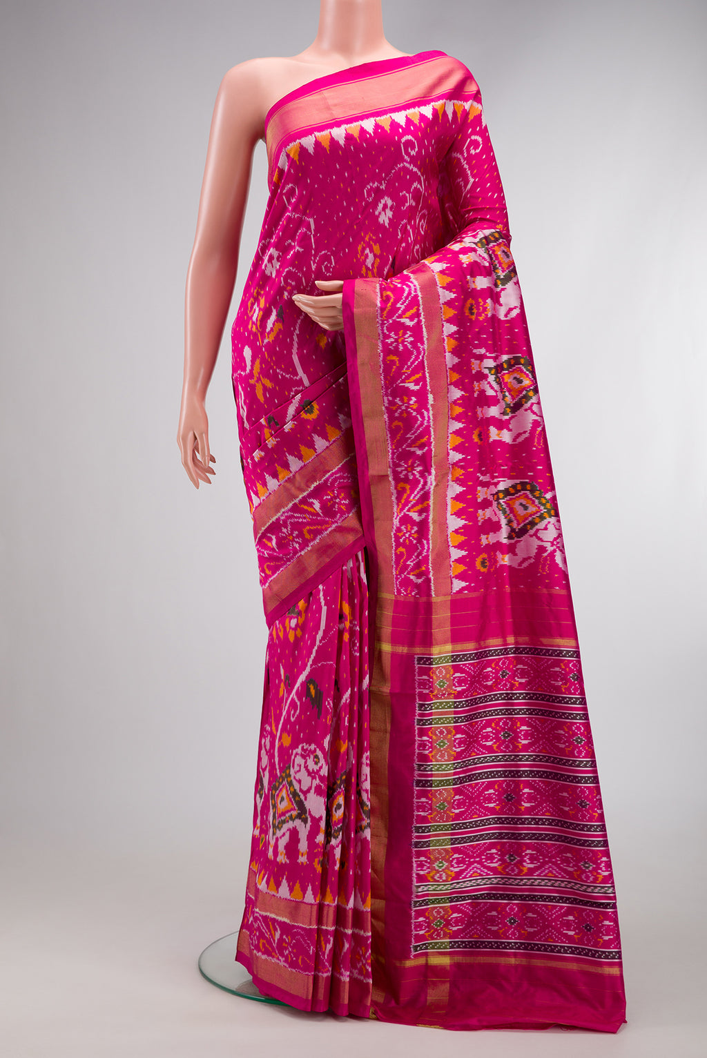 Pink Dual Tone Double Ikat Saree with Ikat Print on the body and Ikat Border.  displayed on a mannequin