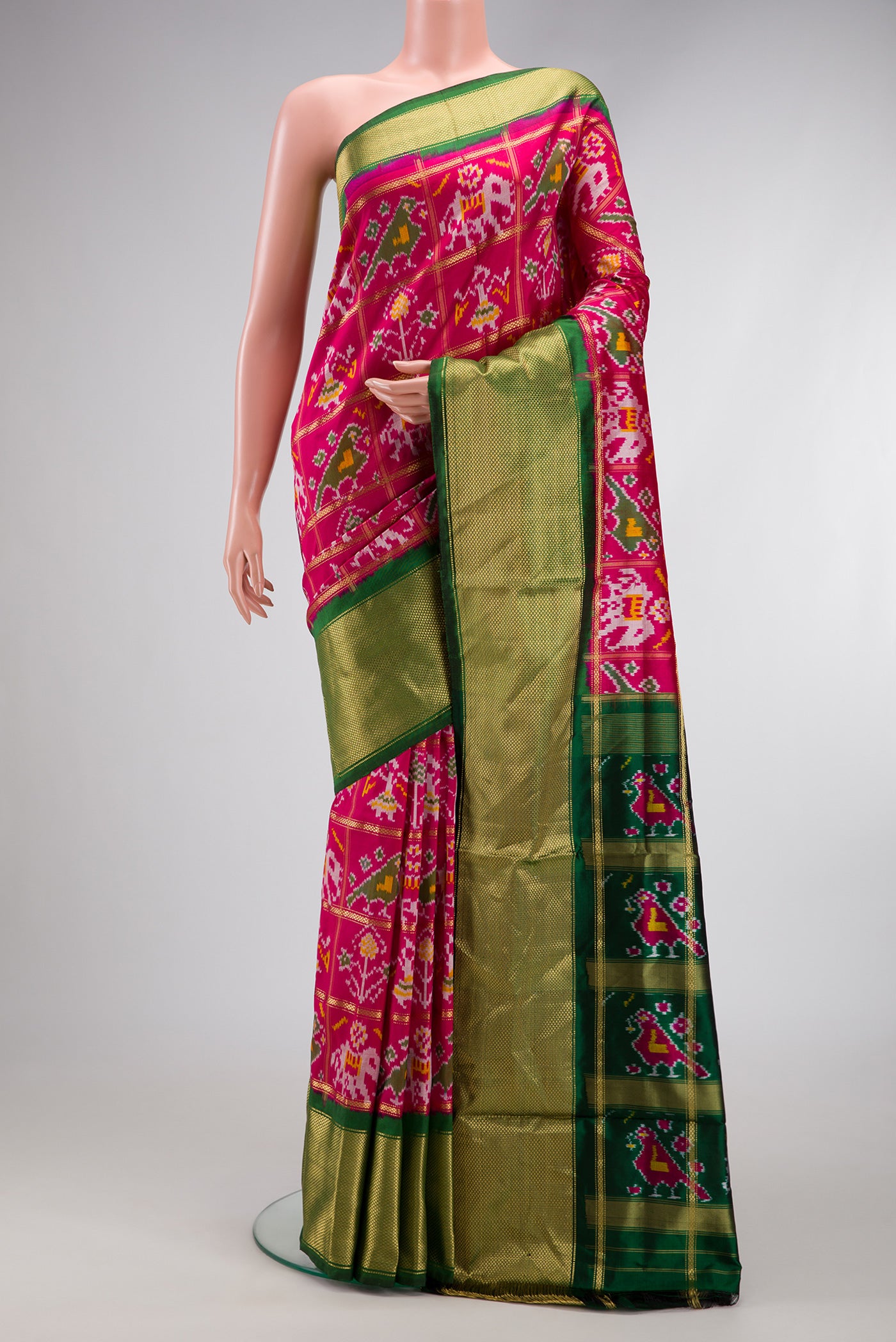 Pink Dual Tone Double Ikat Saree with Ikat Print on the body and Zari Border.  displayed on a mannequin