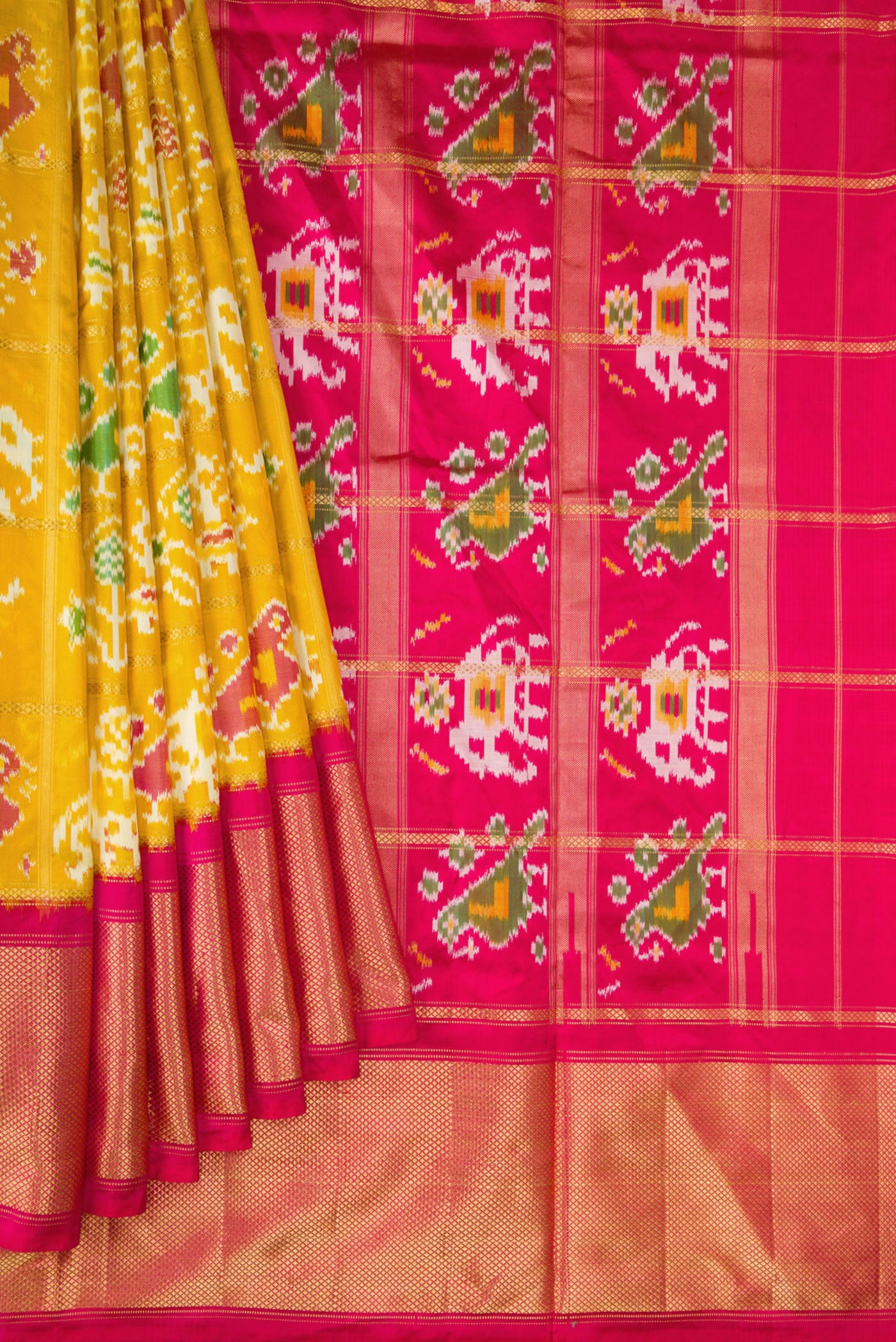 Pleats and pallu of Mustard Dual Tone Double Ikat Saree with Ikat Print on the body and Zari Border. 