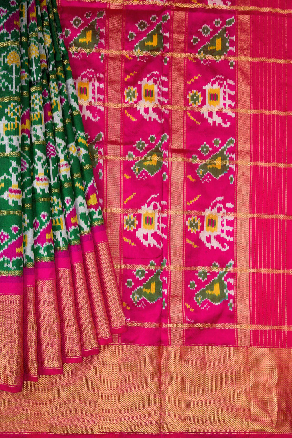 Pleats and pallu of Bottle Green Dual Tone Double Ikat Saree with Ikat Print on the body and Zari Border. 