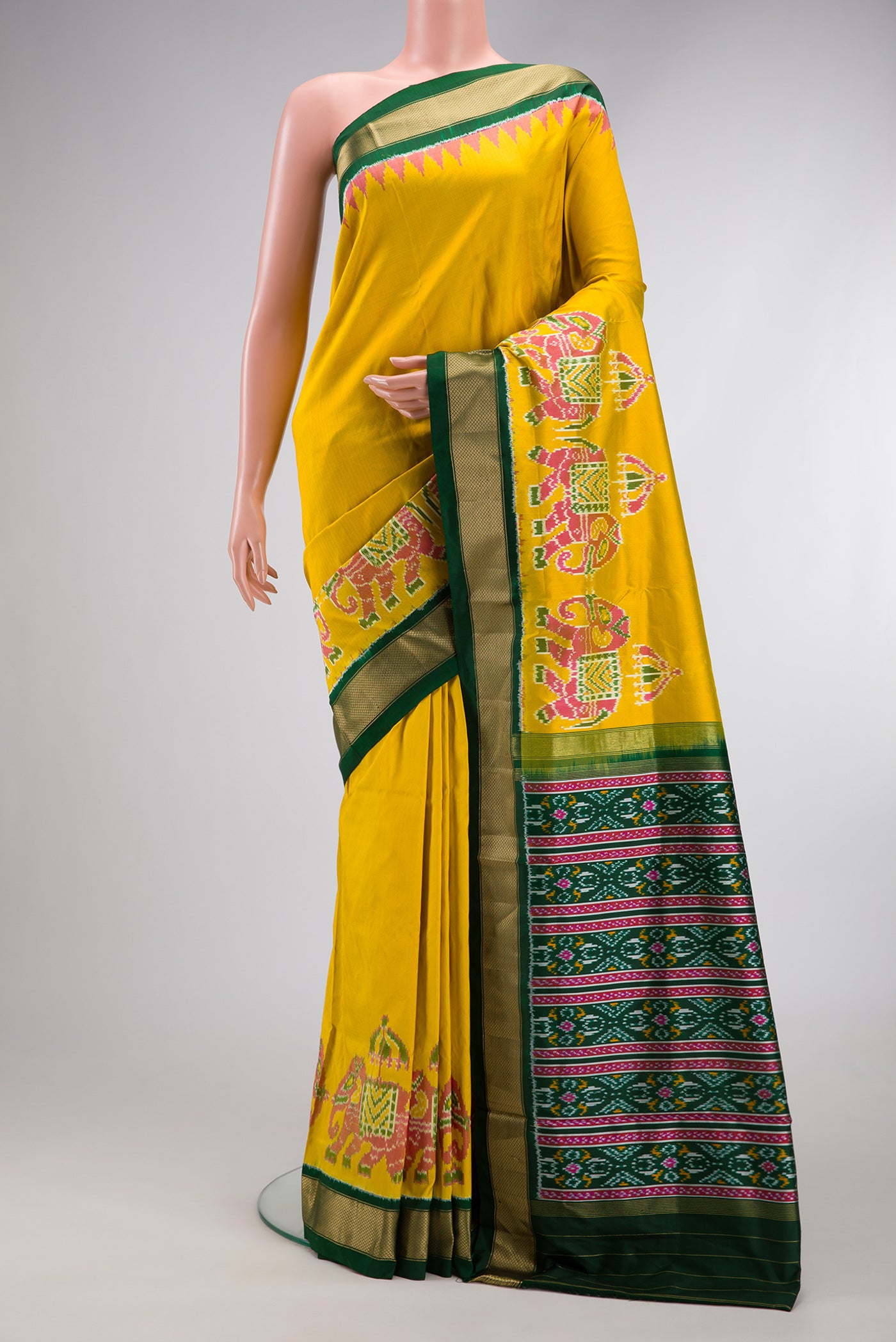 Yellow Dual Tone Double Ikat Saree with Plain Body and Zari Border.  displayed on a mannequin