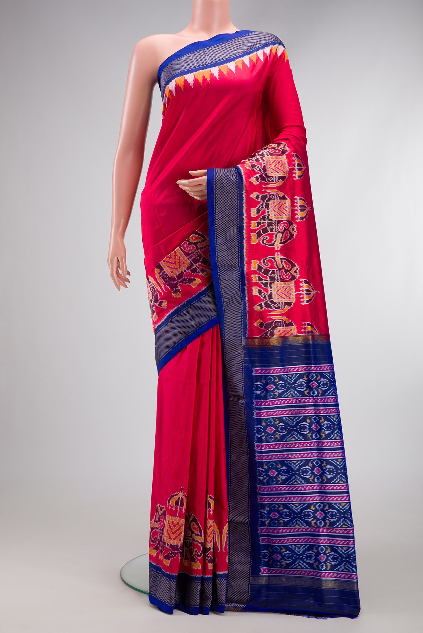 Pink Dual Tone Double Ikat Saree with Plain Body and Zari Border.  displayed on a mannequin