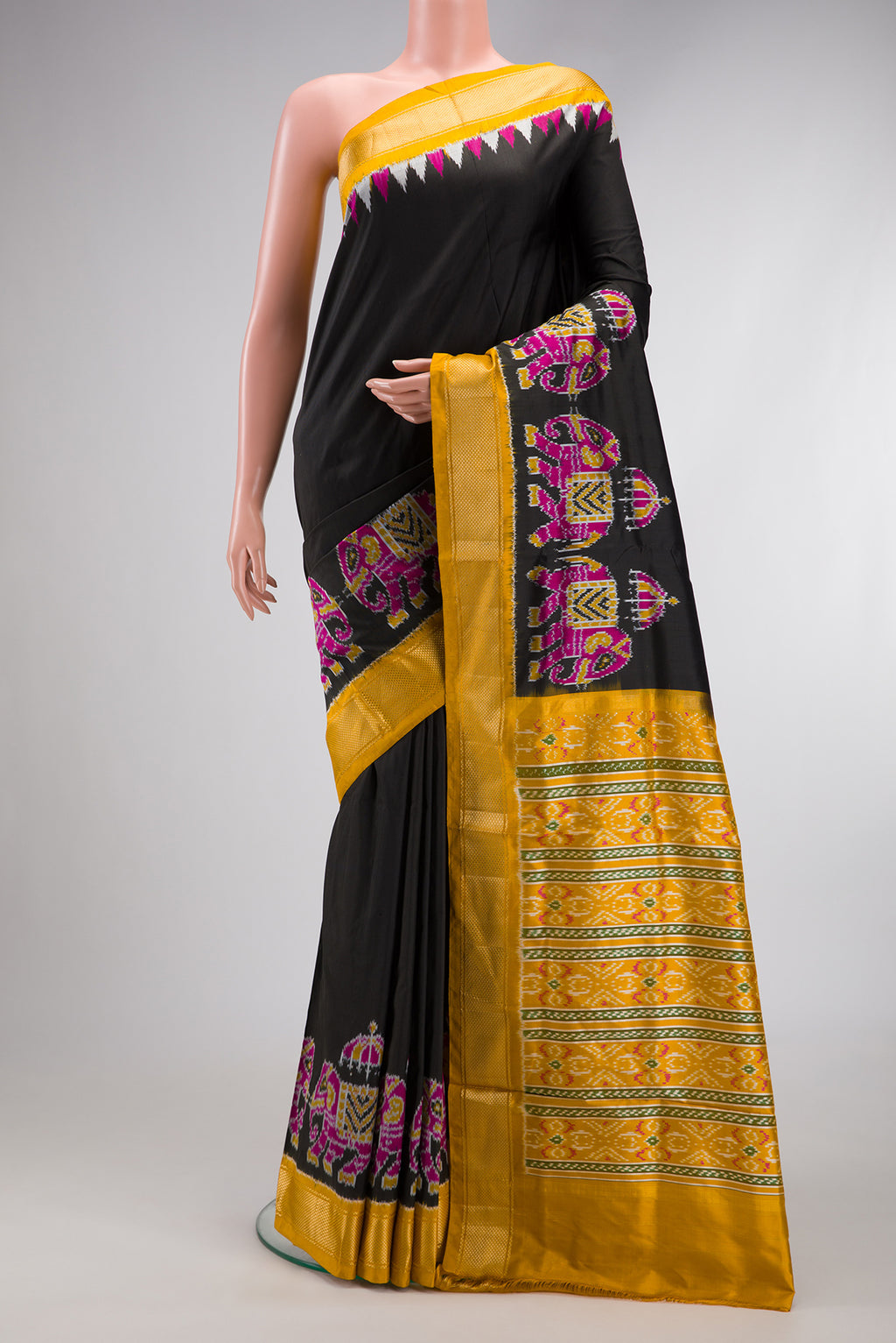 Black Dual Tone Double Ikat Saree with Plain Body and Zari Border.  displayed on a mannequin