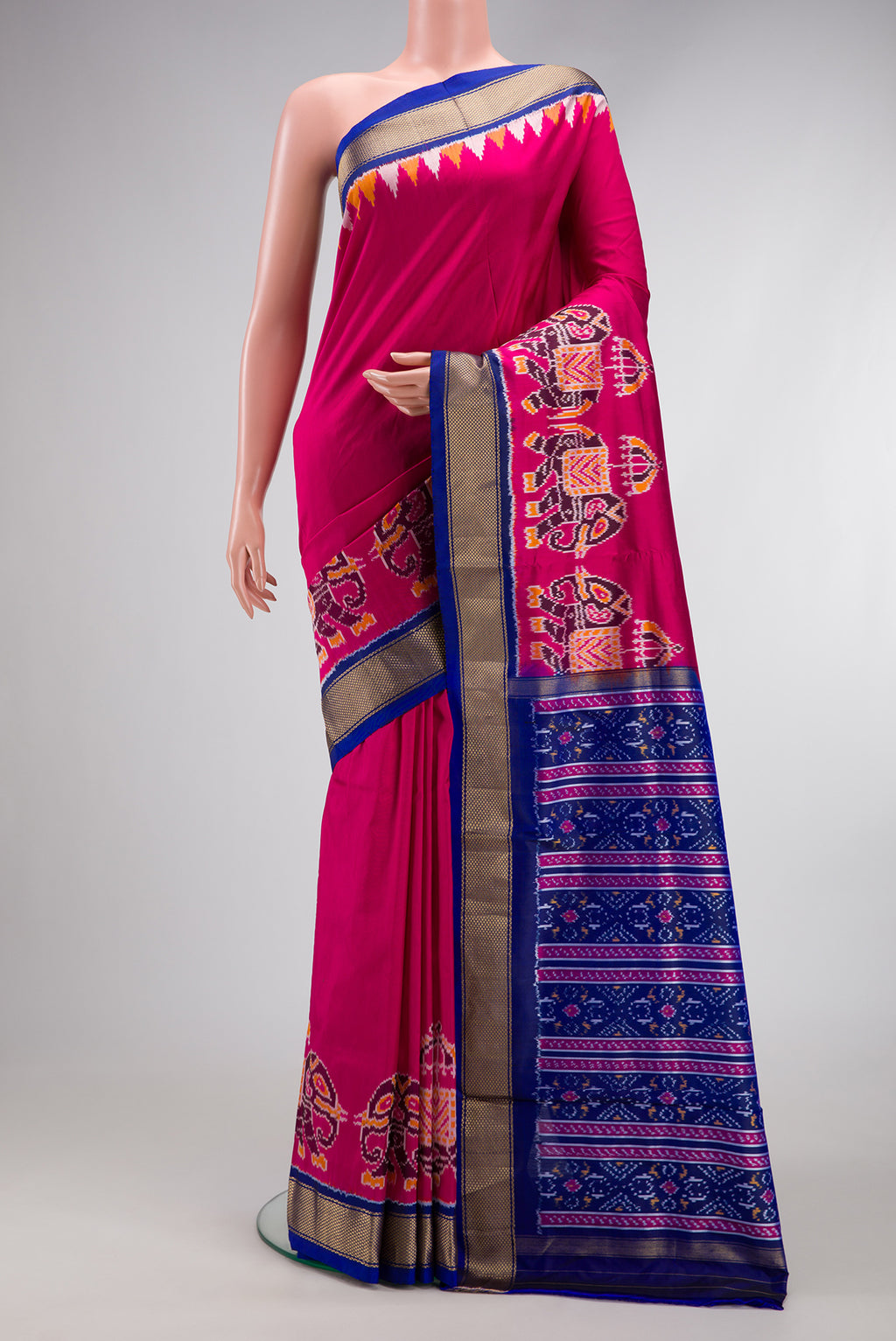 Dark Pink Dual Tone Double Ikat Saree with Plain Body and Fancy Border.  displayed on a mannequin