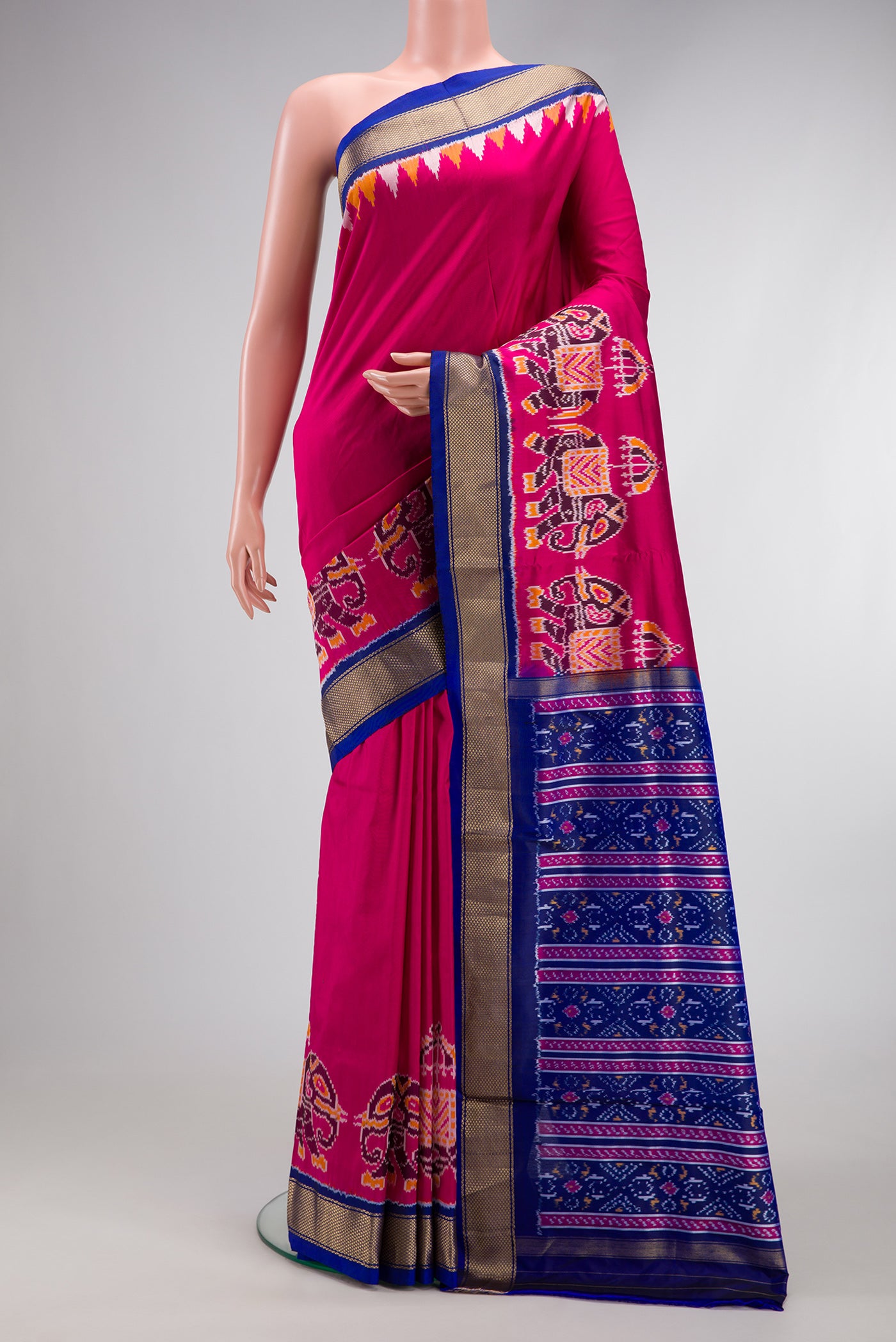 Dark Pink Dual Tone Double Ikat Saree with Plain Body and Fancy Border.  displayed on a mannequin