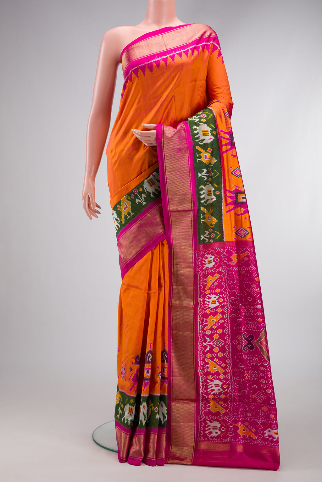 Coral Dual Tone Double Ikat Saree with Ikat Print on the body and Fancy Border.  displayed on a mannequin