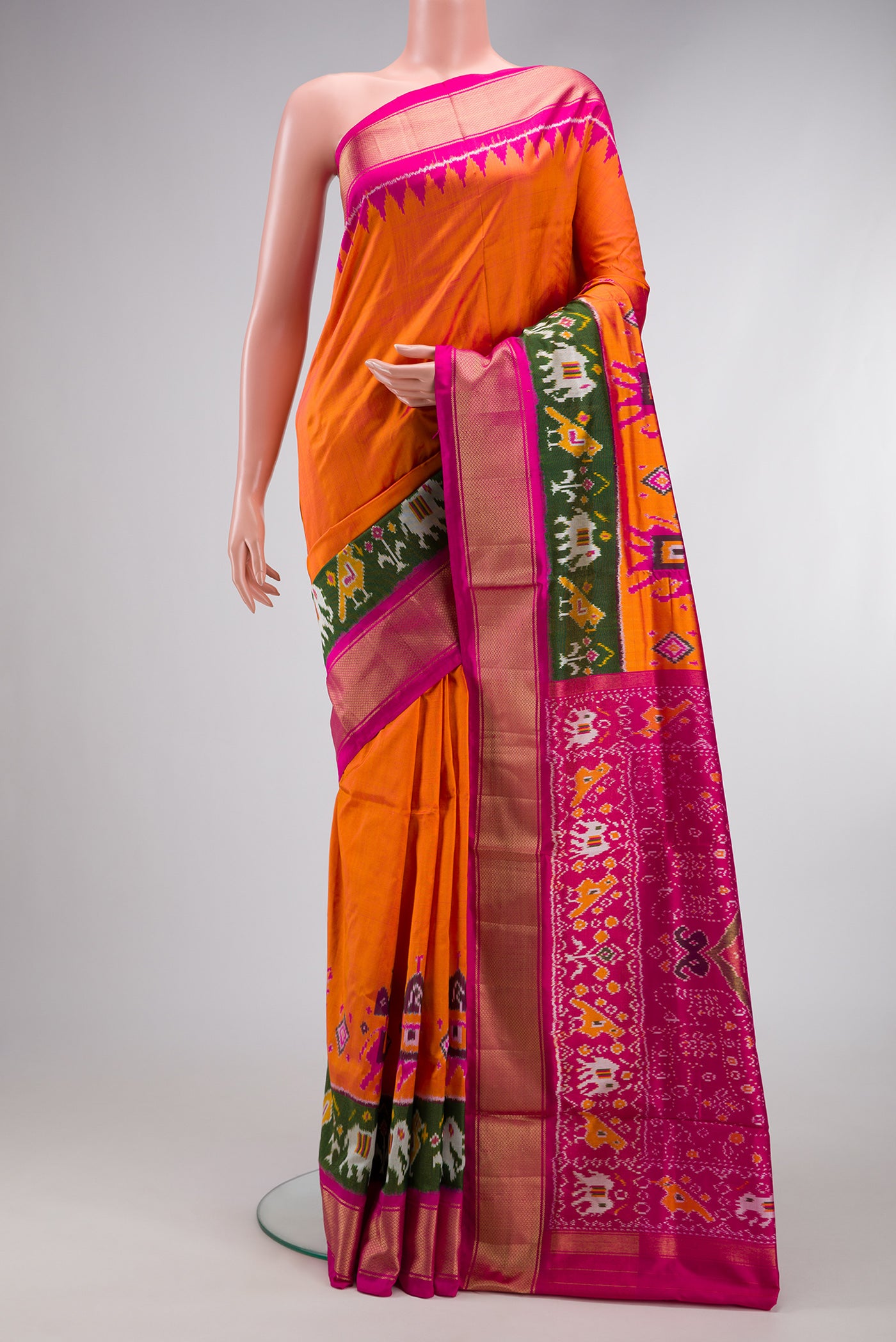 Coral Dual Tone Double Ikat Saree with Ikat Print on the body and Fancy Border.  displayed on a mannequin