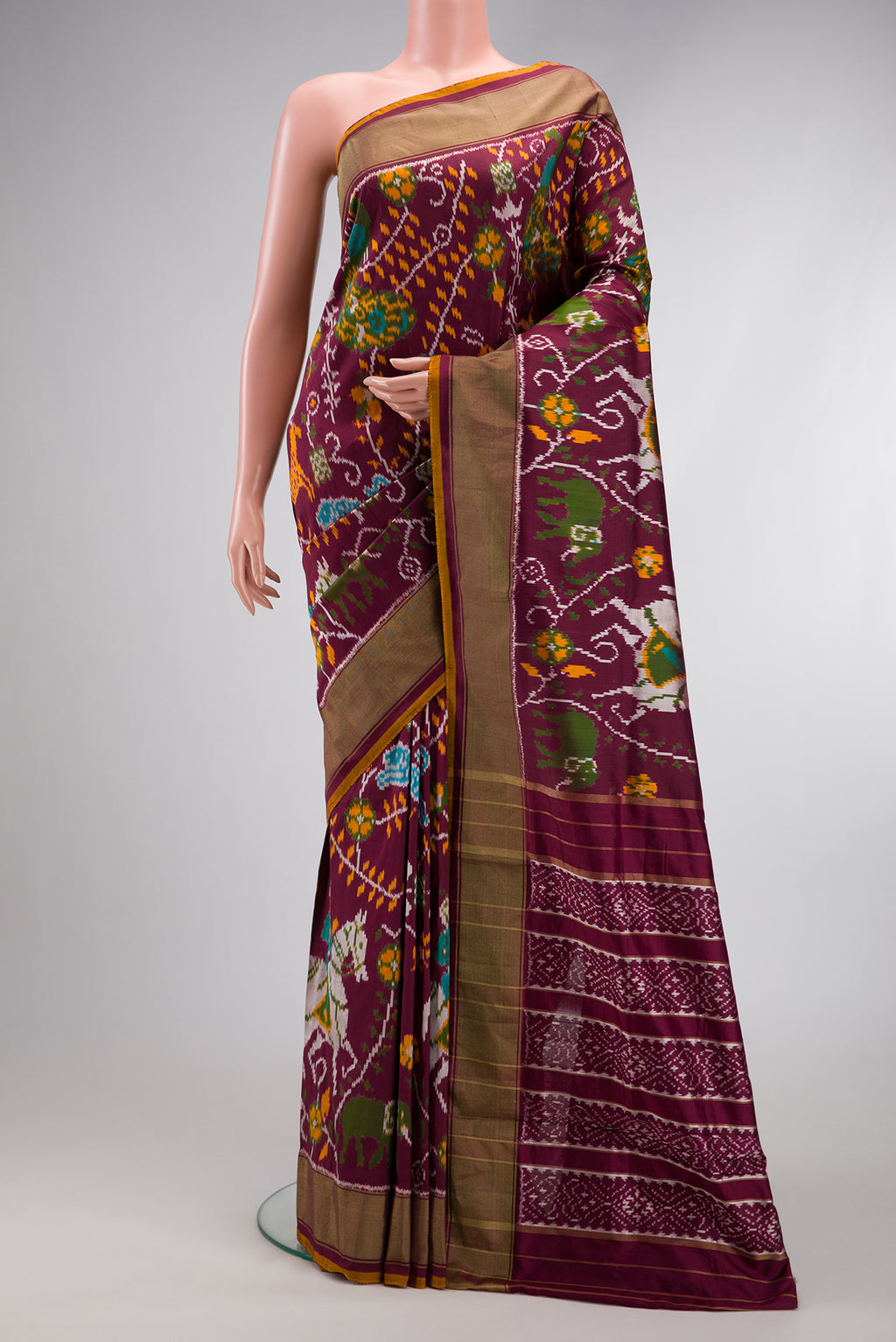 Coffee Brown Dual Tone Double Ikat Saree with Ikat Print on the body and Zari Border.  displayed on a mannequin