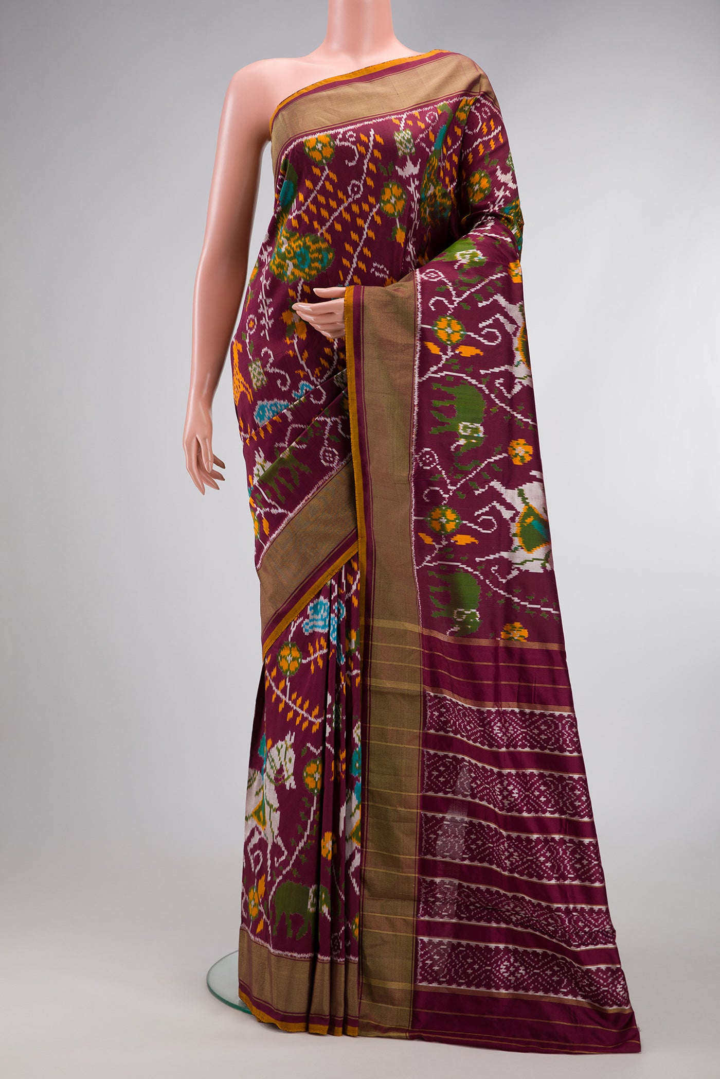 Coffee Brown Dual Tone Double Ikat Saree with Ikat Print on the body and Zari Border.  displayed on a mannequin