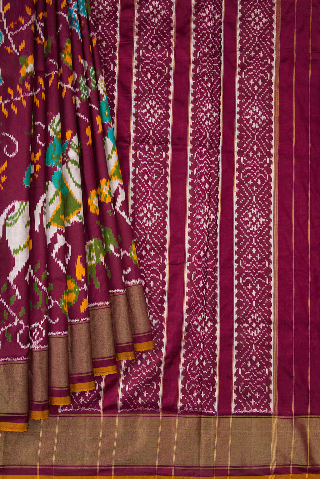 Pleats and pallu of Coffee Brown Dual Tone Double Ikat Saree with Ikat Print on the body and Zari Border. 