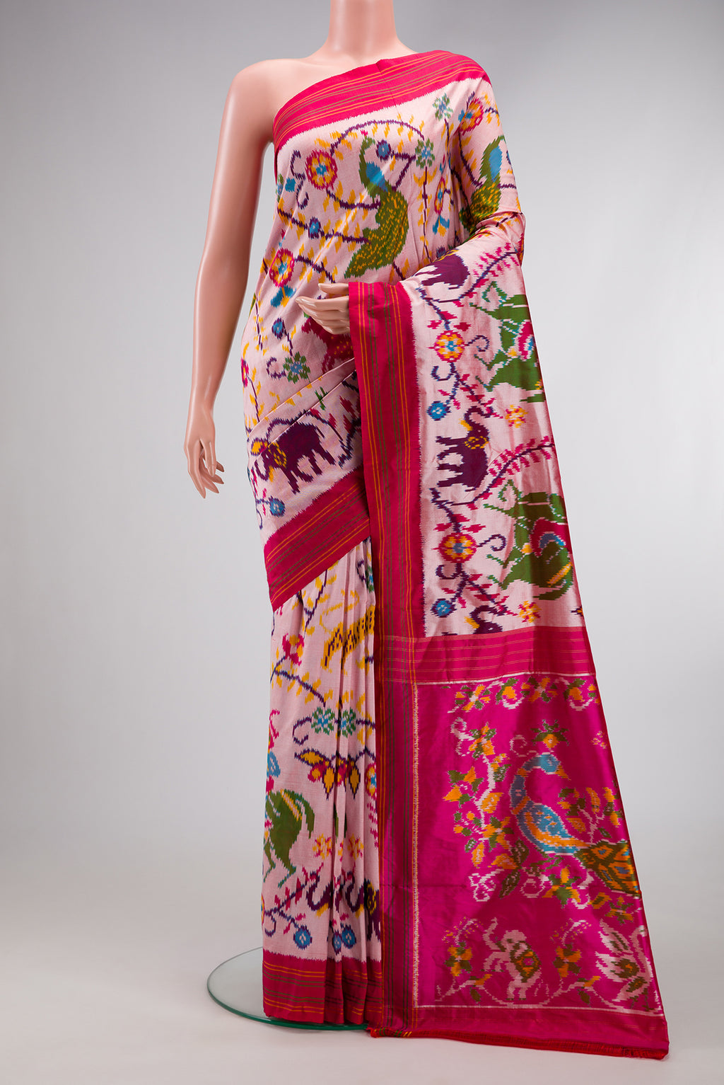 Pink Dual Tone Double Ikat Saree with Ikat Print on the body and Thread Border.  displayed on a mannequin