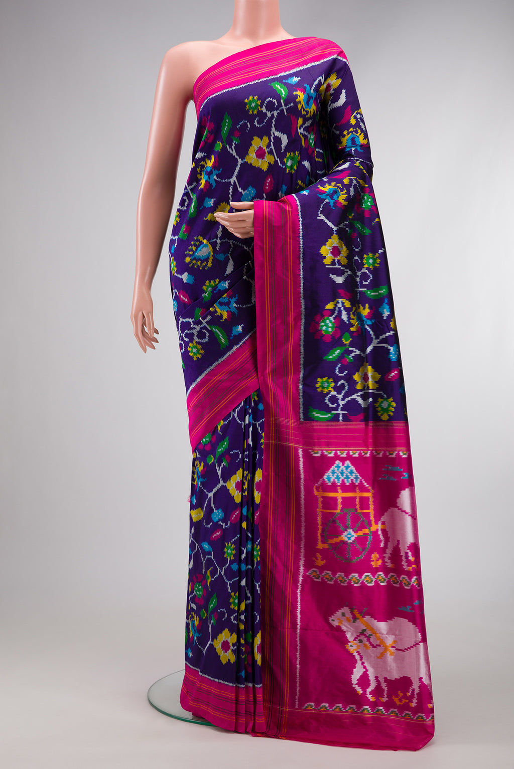 Violet Dual Tone Double Ikat Saree with Ikat Print on the body and Thread Border.  displayed on a mannequin