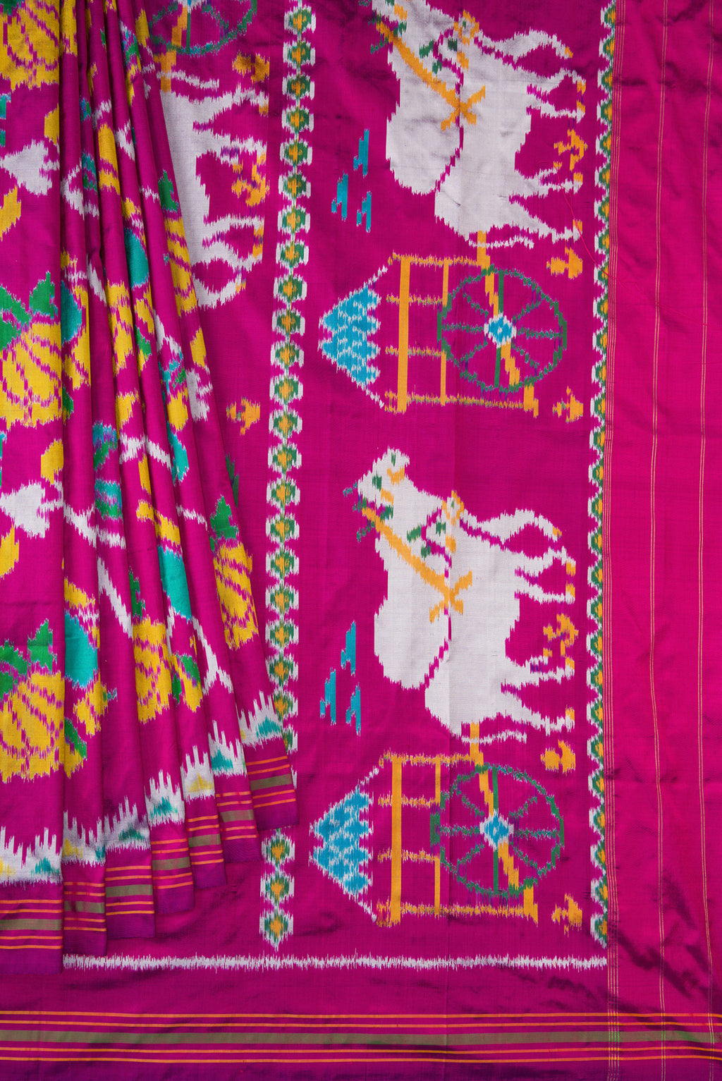 Pleats and pallu of Magenta Dual Tone Double Ikat Saree with Ikat Print on the body and Ikat Border. 