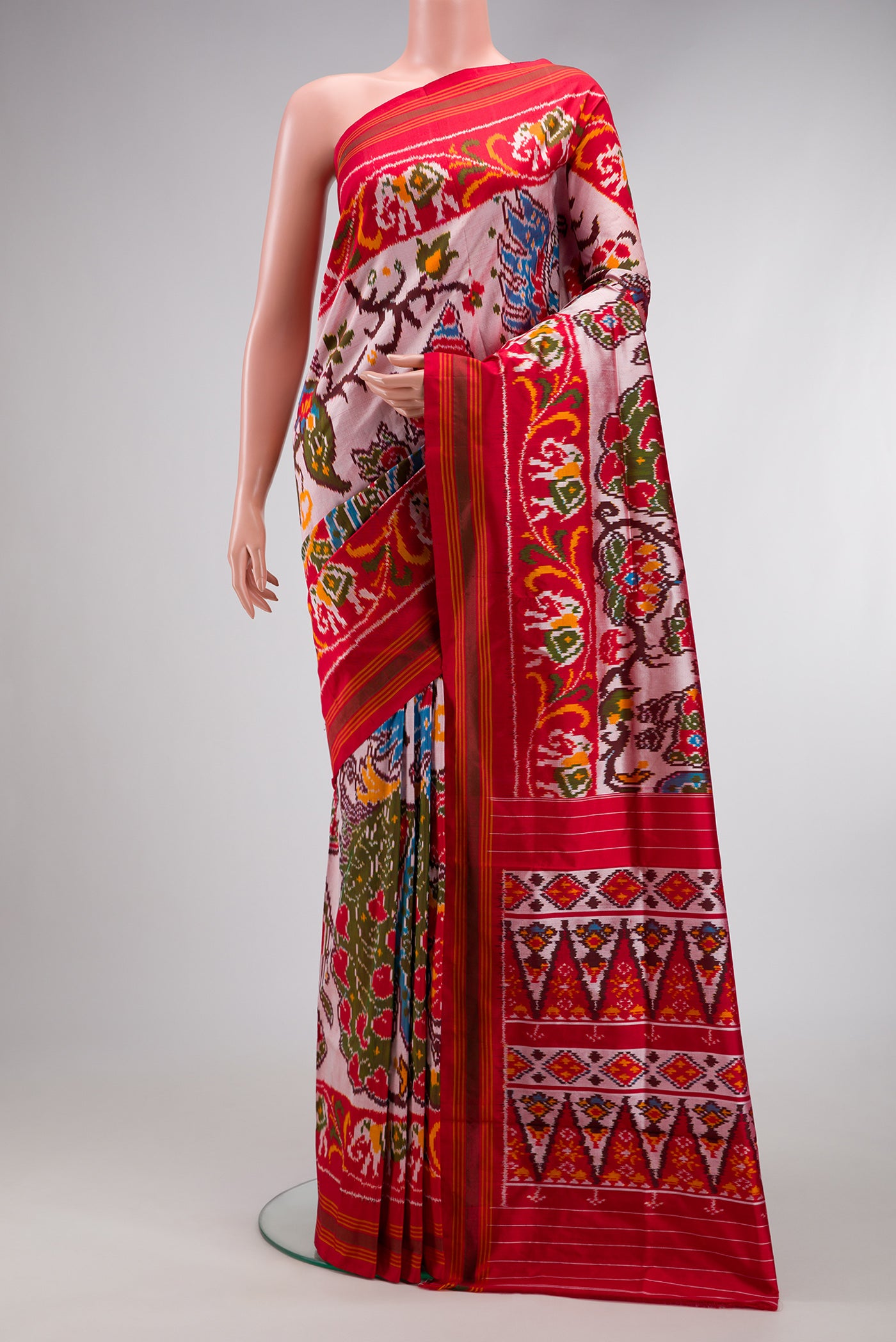 Mustard Dual Tone Double Ikat Saree with Ikat Print on the body and Ikat Border.  displayed on a mannequin