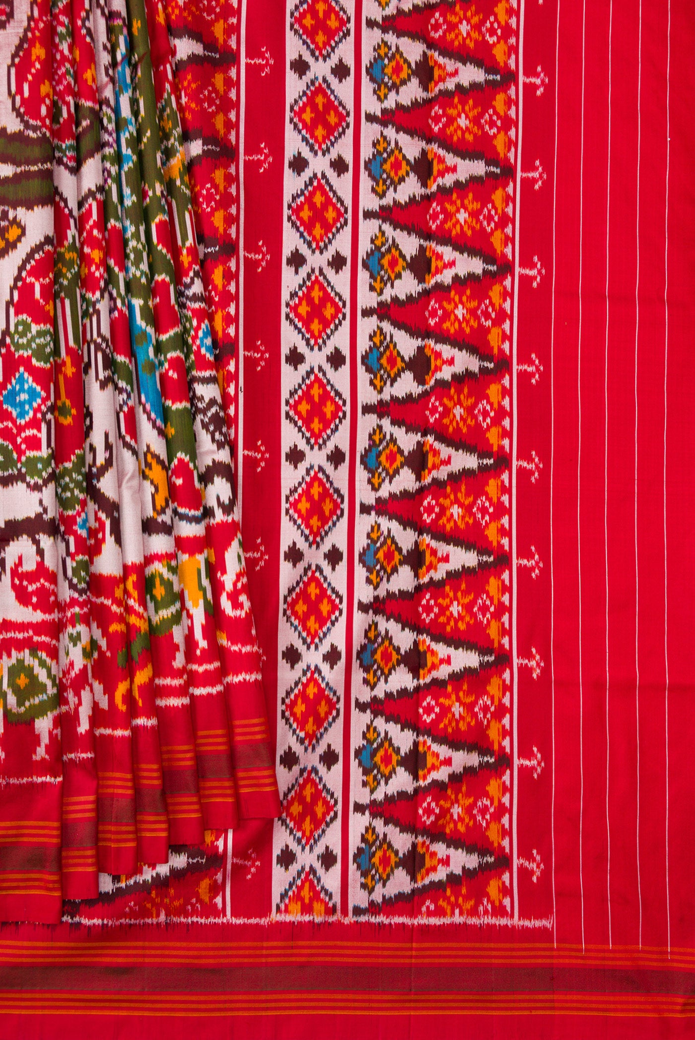 Pleats and pallu of Mustard Dual Tone Double Ikat Saree with Ikat Print on the body and Ikat Border. 
