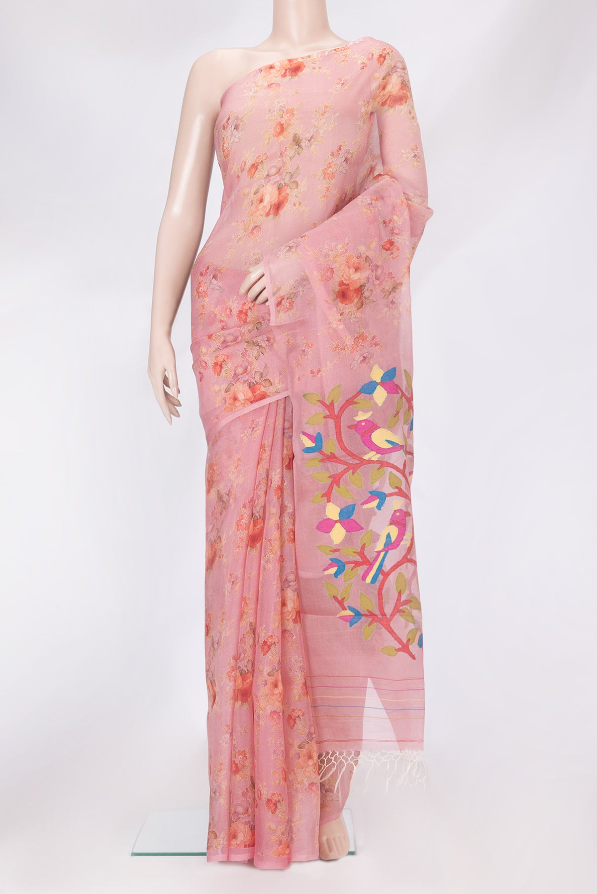 Coral Organza Silk Saree with Floral Print on the body and Without Border.  displayed on a mannequin