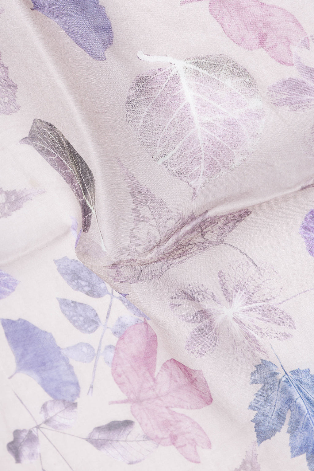 Close up of Grey Dual Tone Tussar Silk Saree with Printed design on the body and Zari Border.  displaying folds