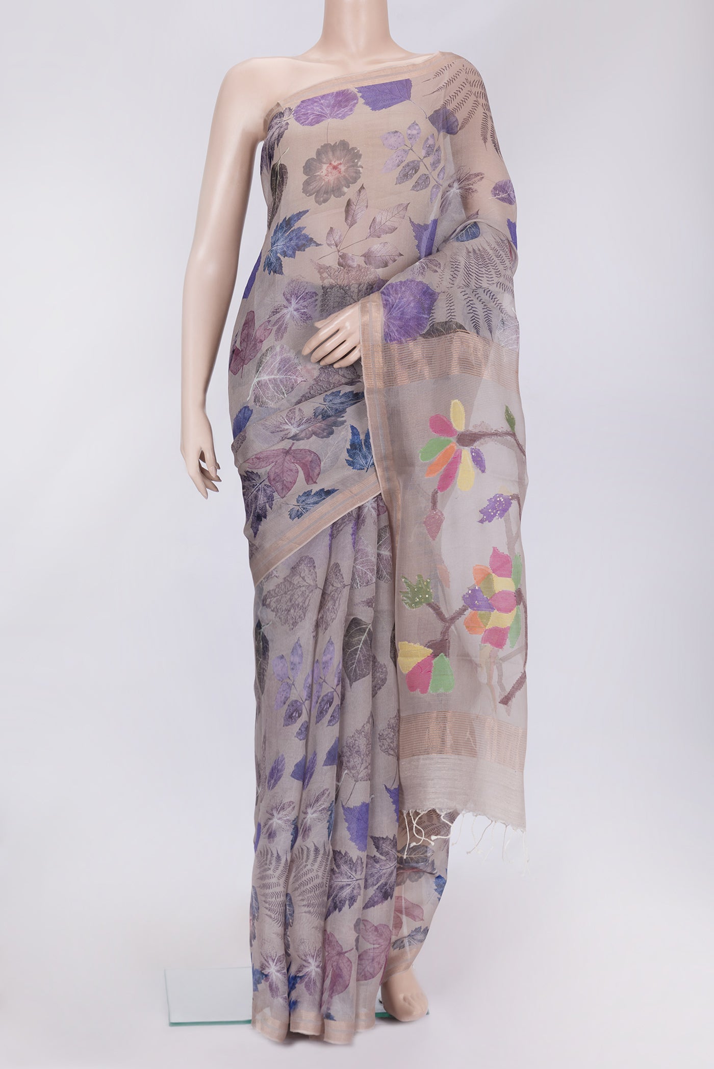 Grey Dual Tone Tussar Silk Saree with Printed design on the body and Zari Border.  displayed on a mannequin