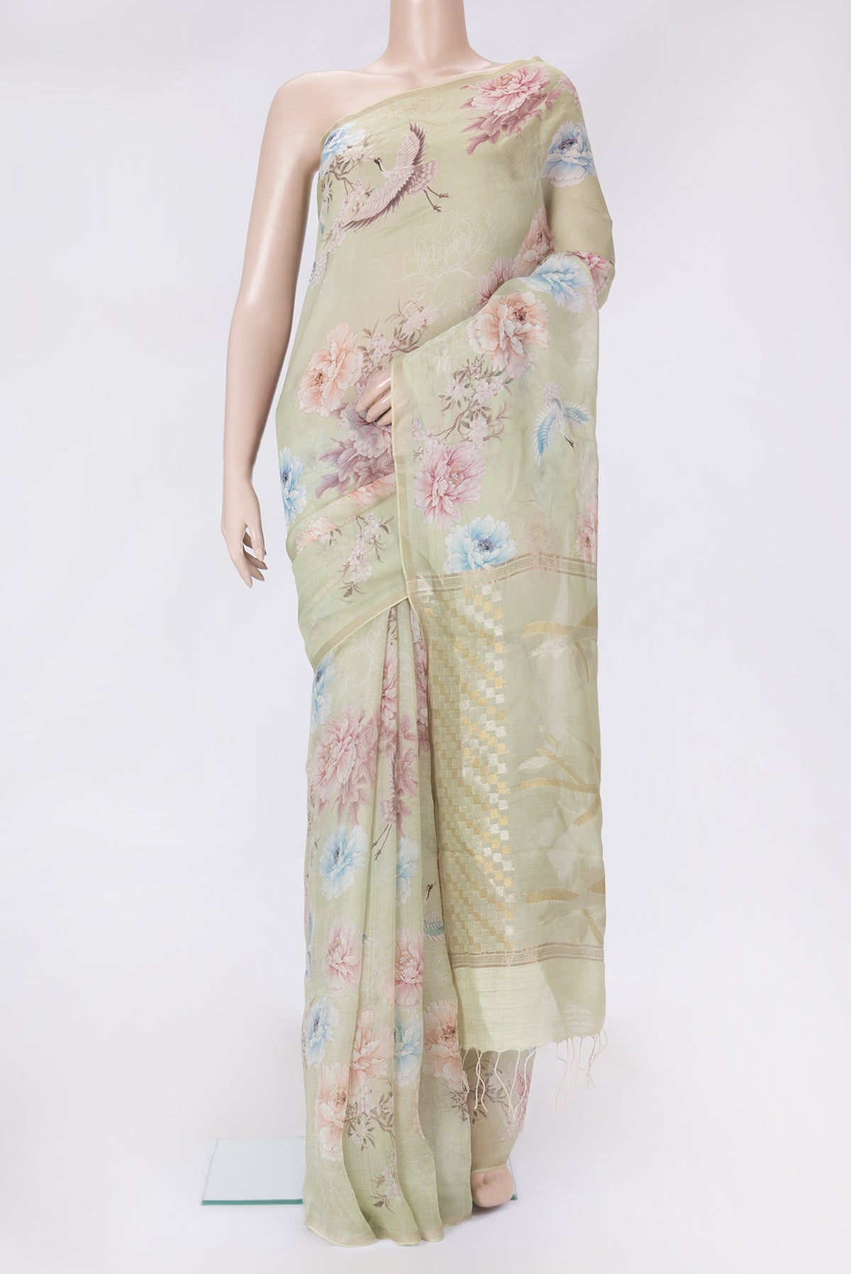Pista Green Dual Tone Tussar Silk Saree with Printed design on the body and Zari Border.  displayed on a mannequin