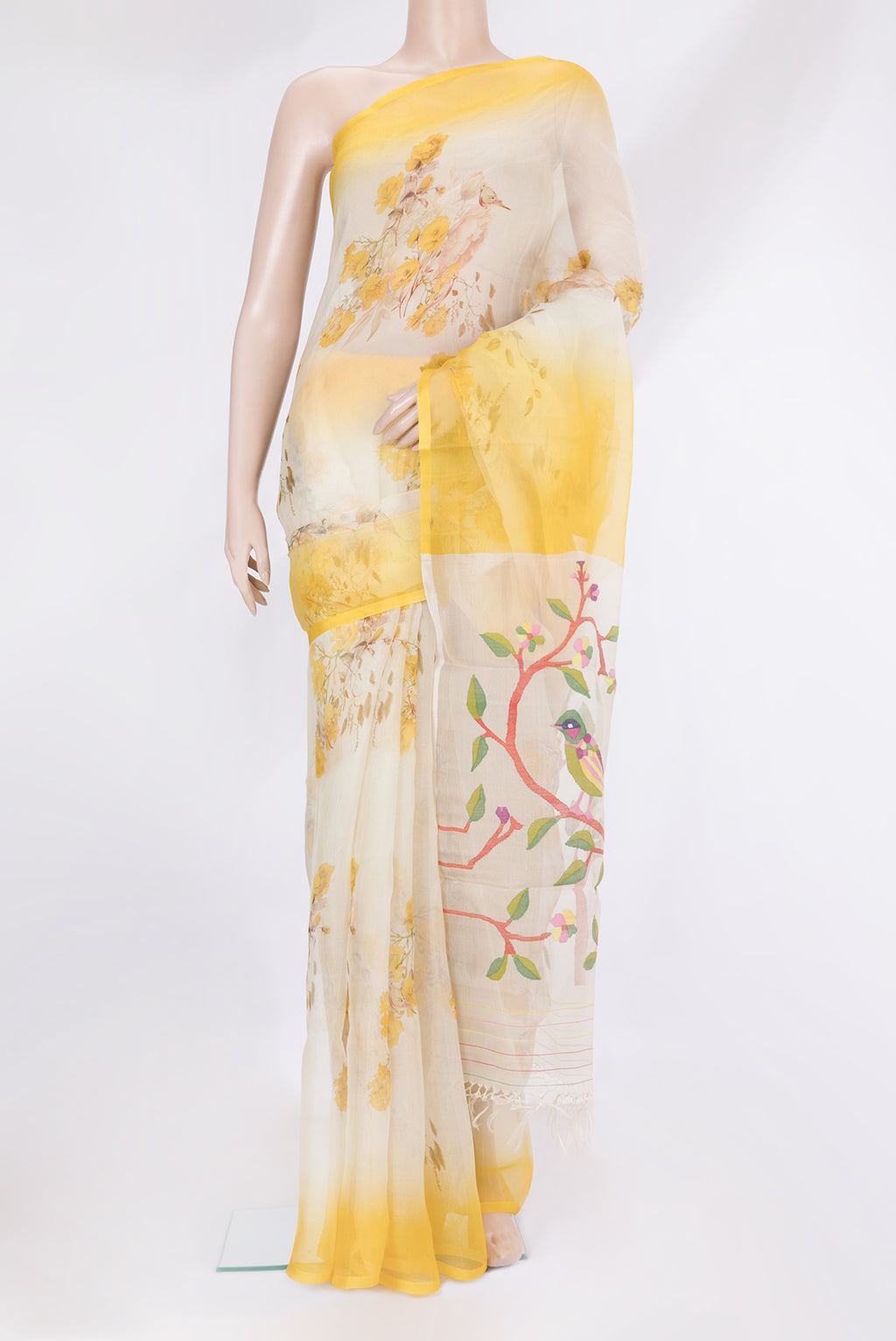 Off White Organza Silk Saree with Floral Print on the body and Plain Border.  displayed on a mannequin