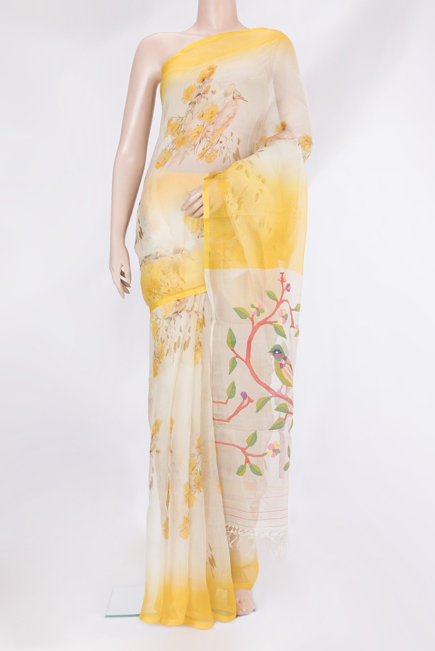 Off White Organza Silk Saree with Floral Print on the body and Plain Border.  displayed on a mannequin