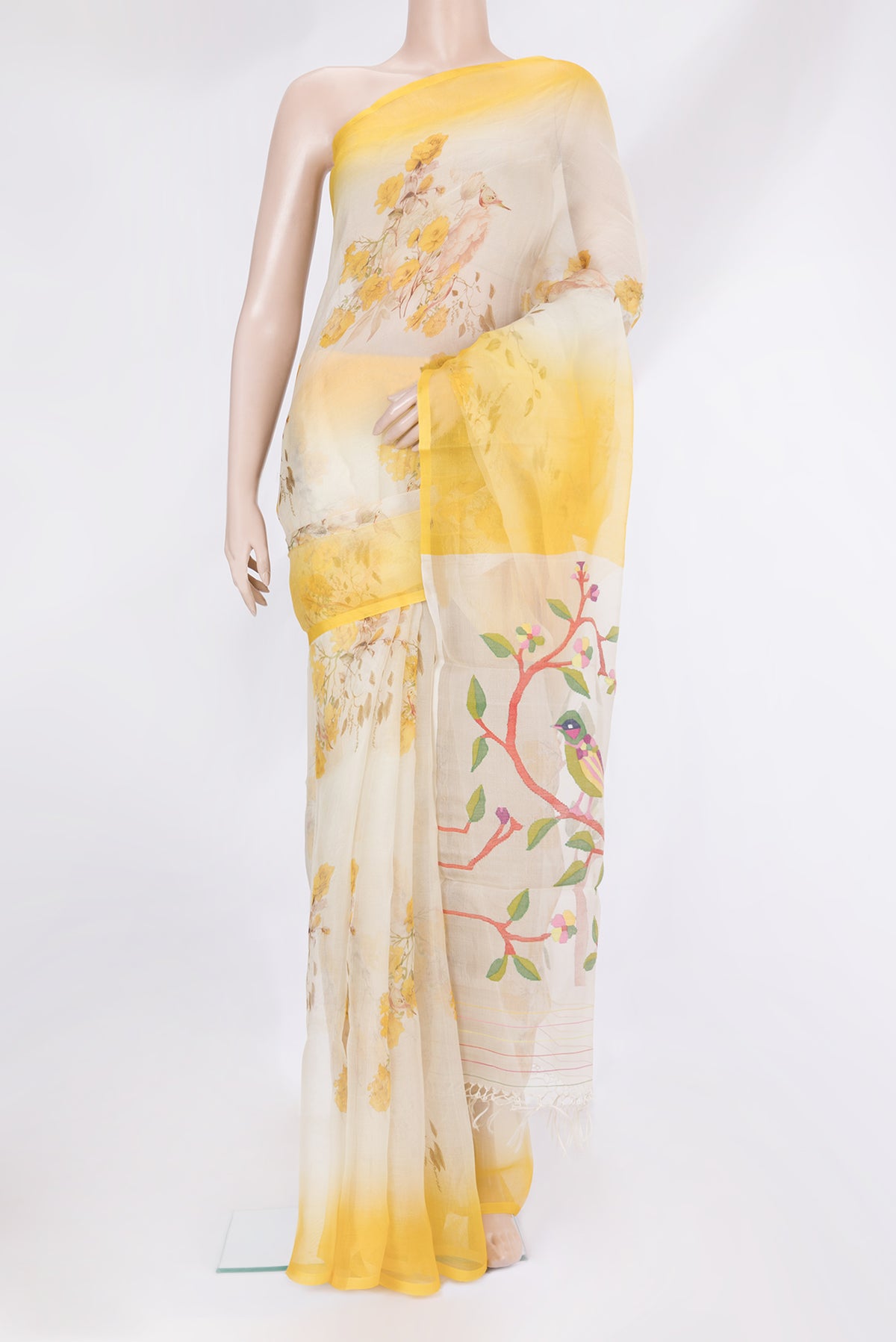 Off White Organza Silk Saree with Floral Print on the body and Plain Border.  displayed on a mannequin