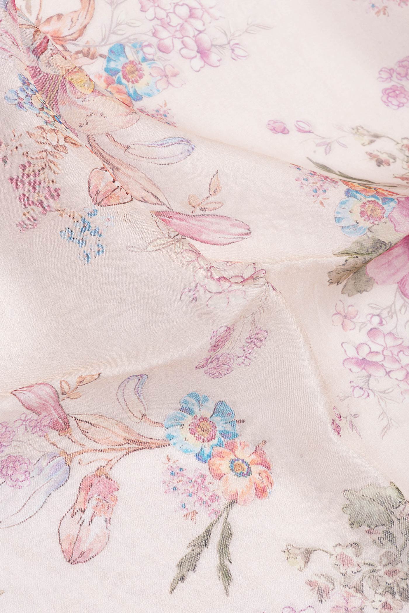 Close up of Rose Gold Dual Tone Tussar Silk Saree with Printed design on the body and Zari Border.  displaying folds