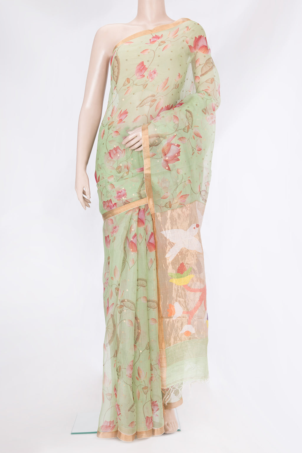 Pista Green Organza Silk Saree with Floral Print on the body and Zari Border.  displayed on a mannequin
