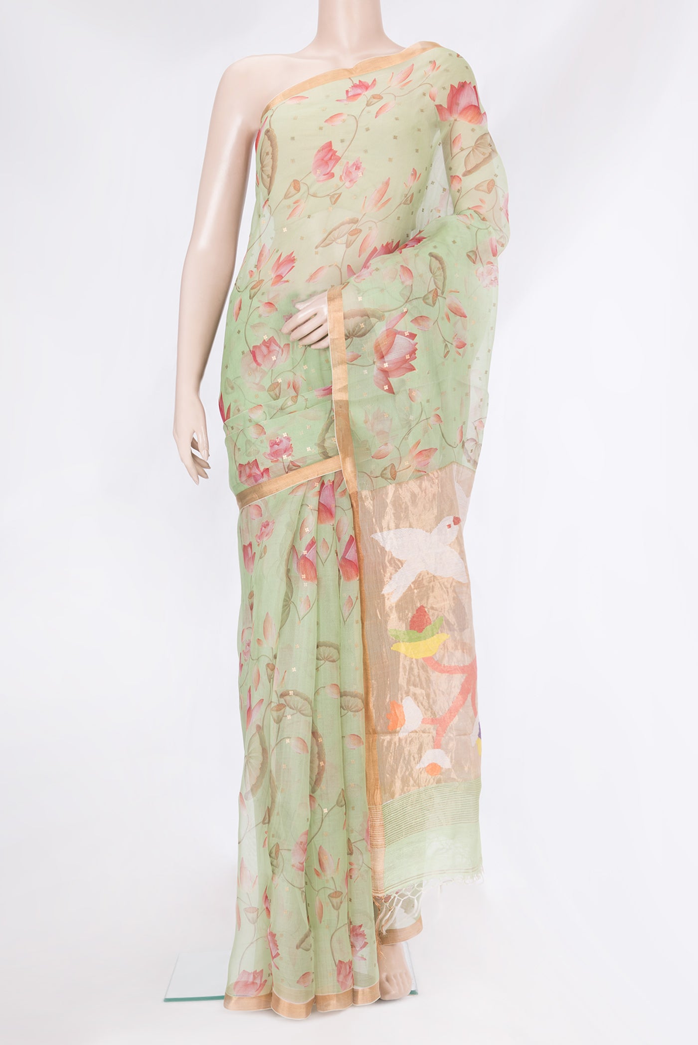 Pista Green Organza Silk Saree with Floral Print on the body and Zari Border.  displayed on a mannequin