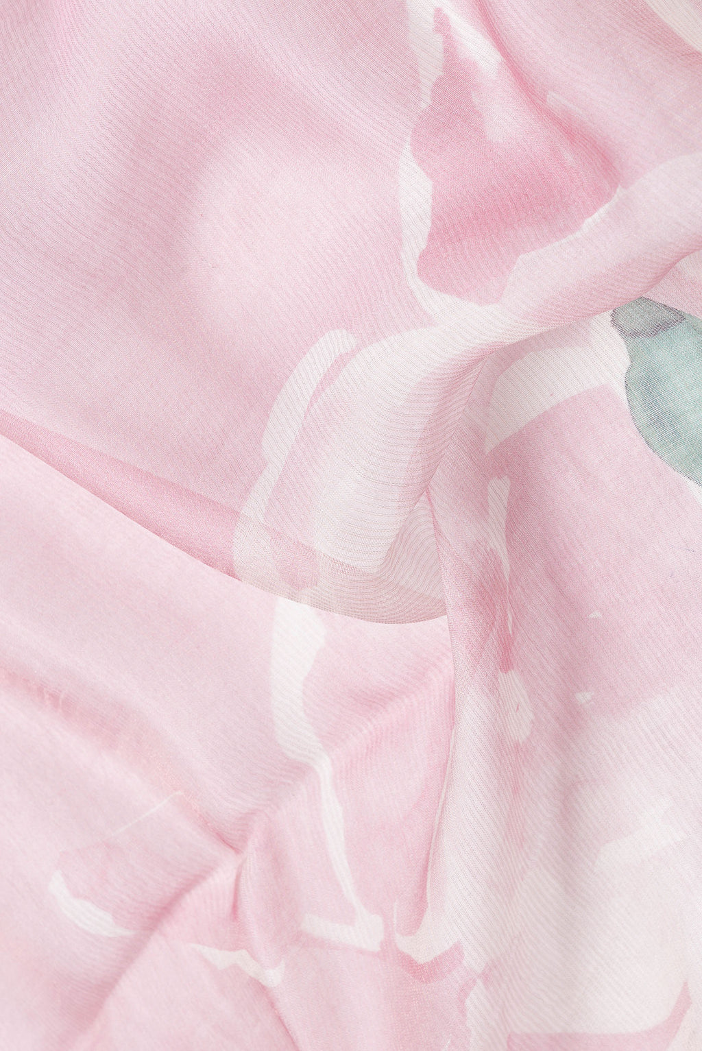 Close up of Pink Dual Tone Tussar Silk Saree with Printed design on the body and Embroidery Border.  displaying folds