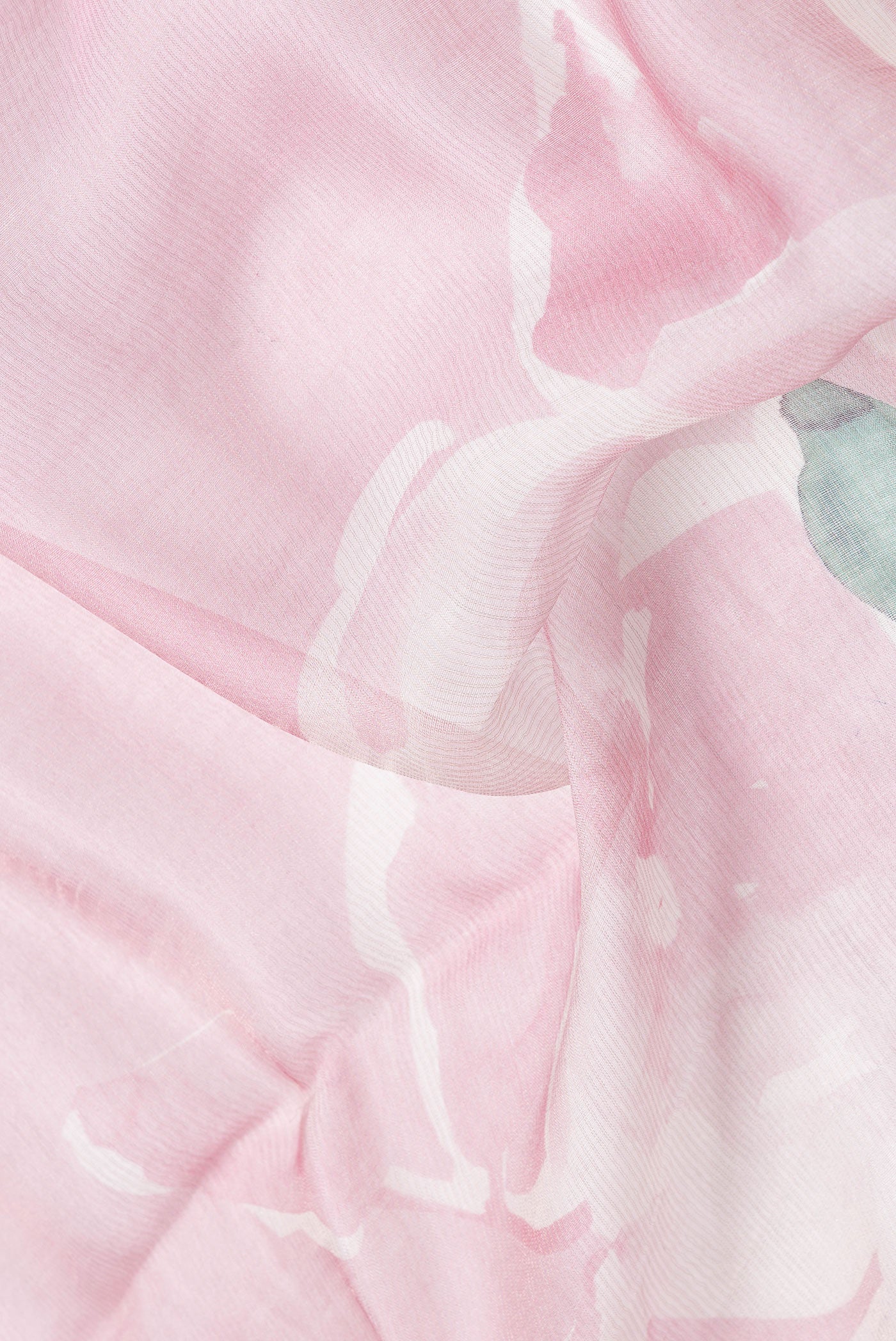 Close up of Pink Dual Tone Tussar Silk Saree with Printed design on the body and Embroidery Border.  displaying folds