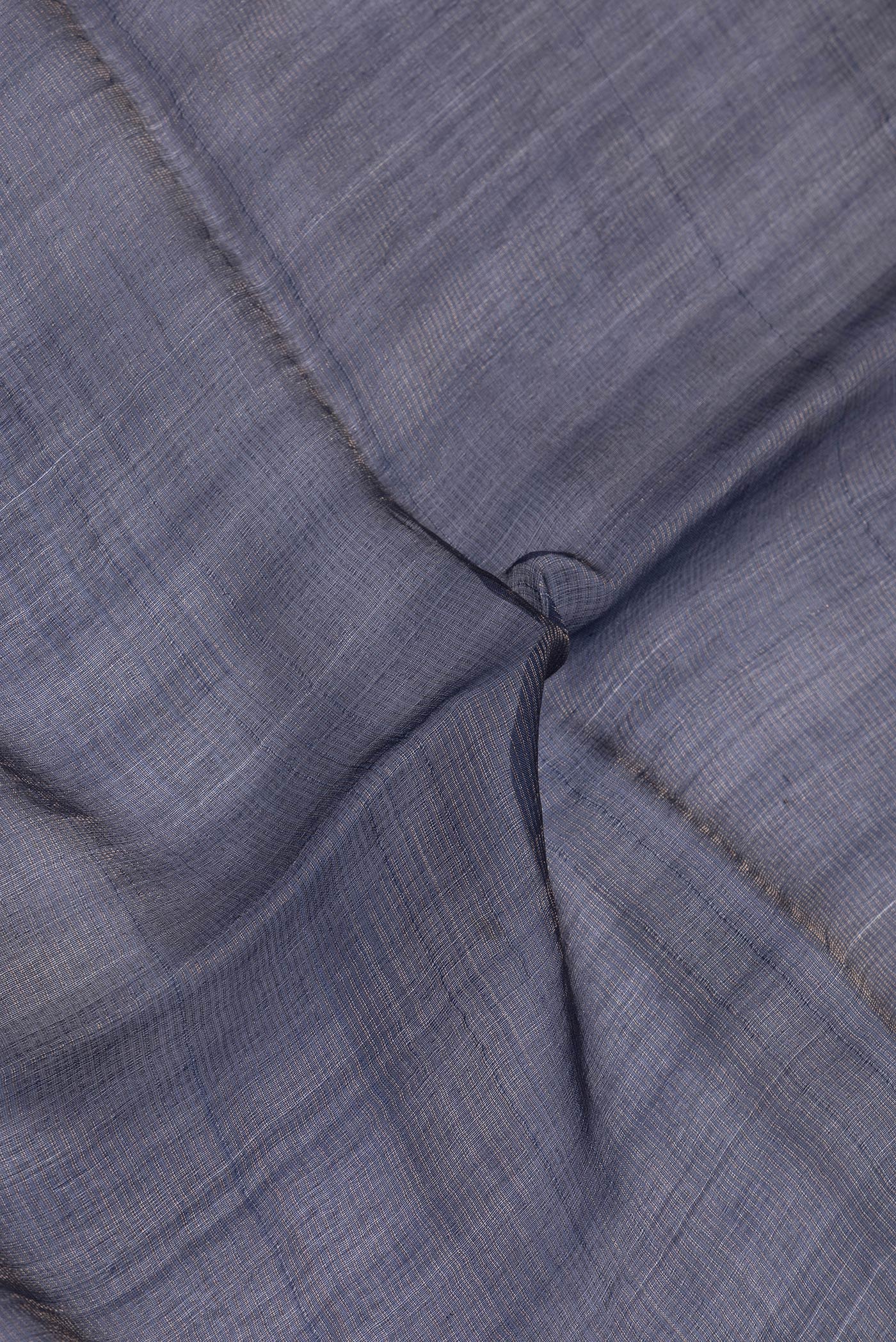 Close up of Navy Blue Dual Tone Tussar Silk Saree with Printed design on the body and Embroidery Border.  displaying folds