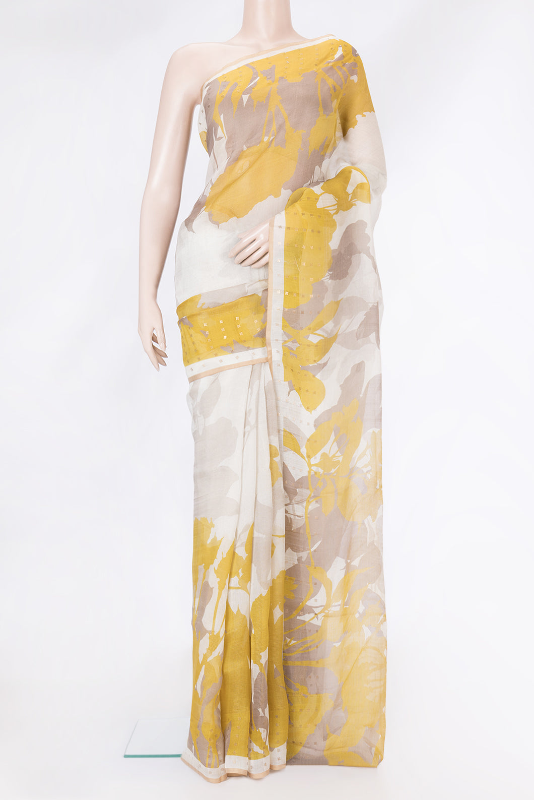Beige Dual Tone Tussar Silk Saree with Printed design on the body and Zari Border.  displayed on a mannequin