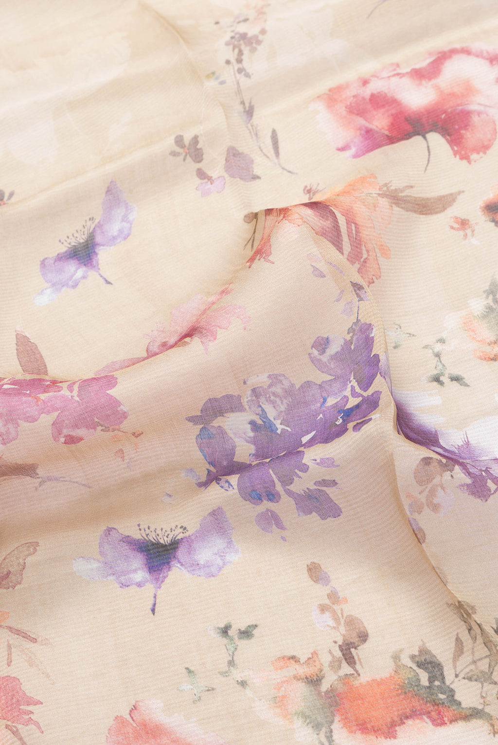 Close up of Caramel Dual Tone Tussar Silk Saree with Printed design on the body and Embroidery Border.  displaying folds