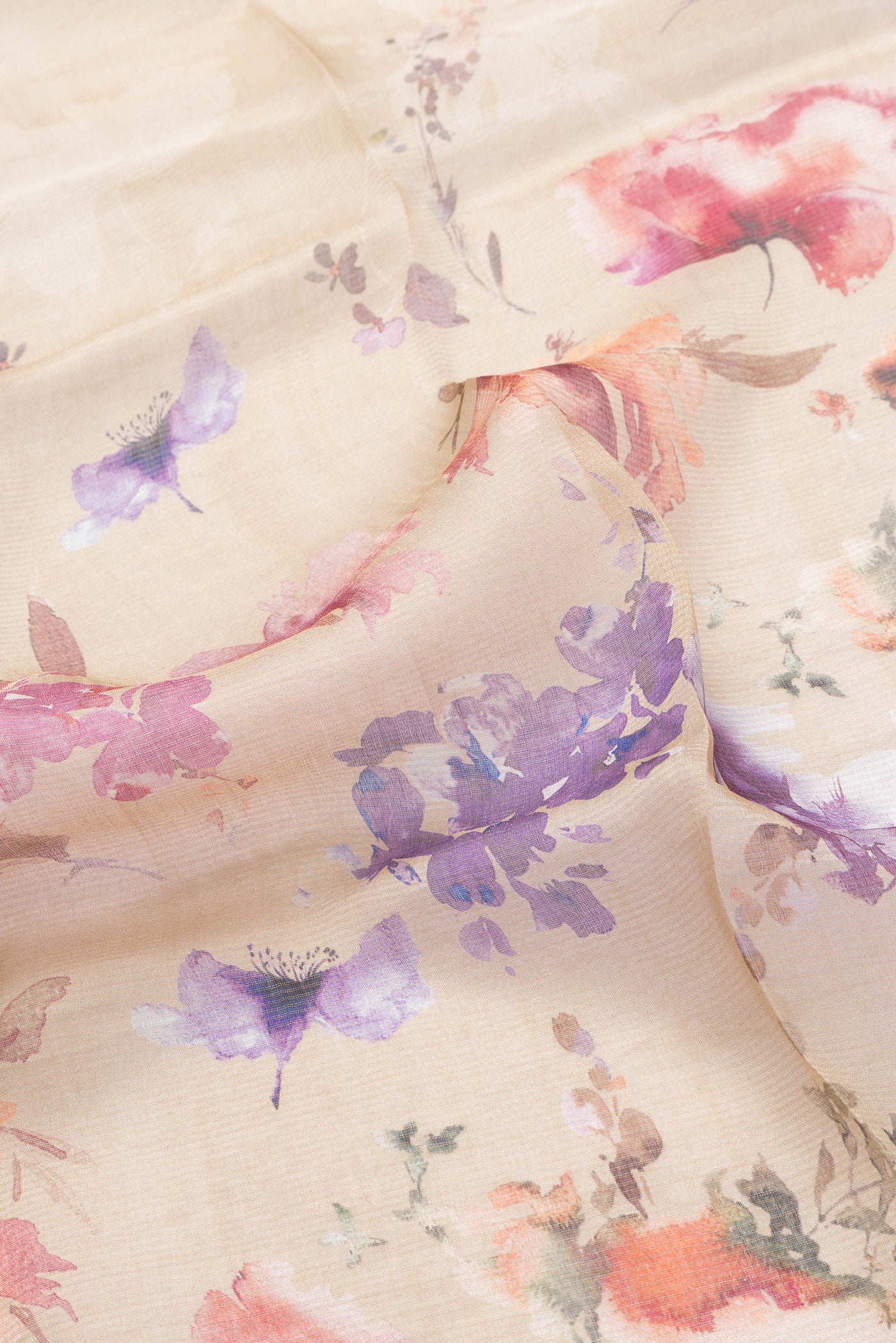 Close up of Caramel Dual Tone Tussar Silk Saree with Printed design on the body and Embroidery Border.  displaying folds