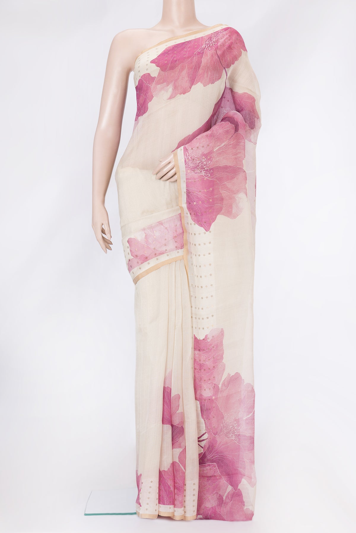 Beige Tussar Silk Saree with Printed design on the body and Zari Border.  displayed on a mannequin