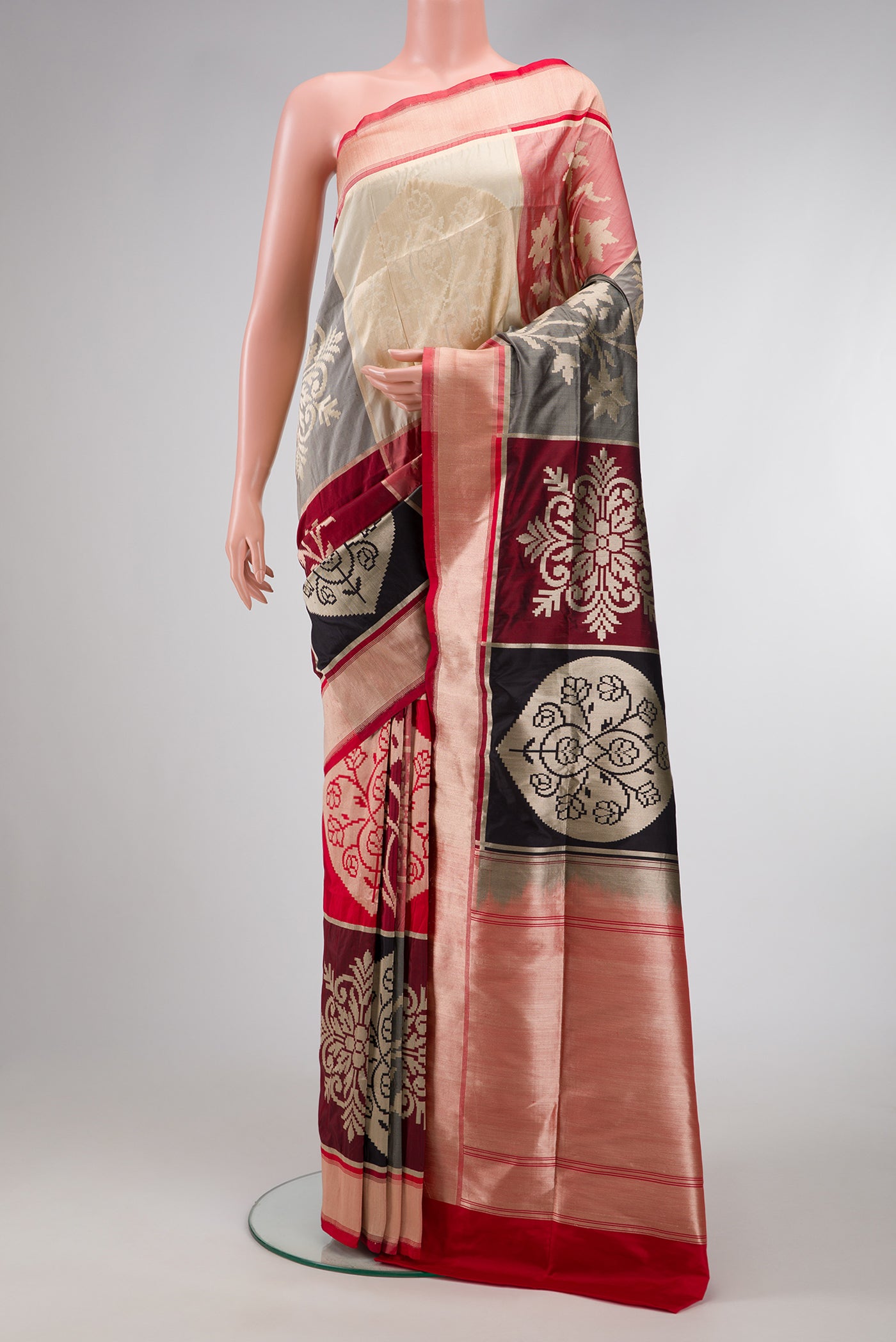 Red, Maroon, Black and Off White Color Banarasi Silk Saree with Zari Brocade on the body and Zari Border.  displayed on a mannequin