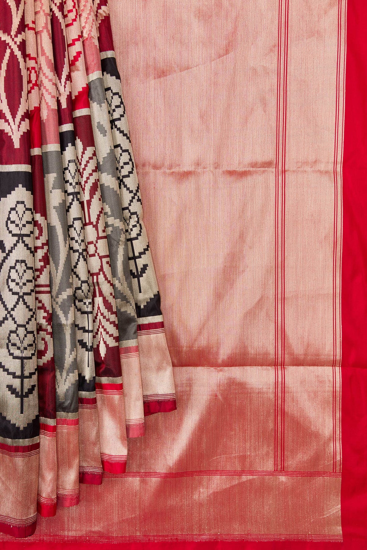 Pleats and pallu of Red, Maroon, Black and Off White Color Banarasi Silk Saree with Zari Brocade on the body and Zari Border. 