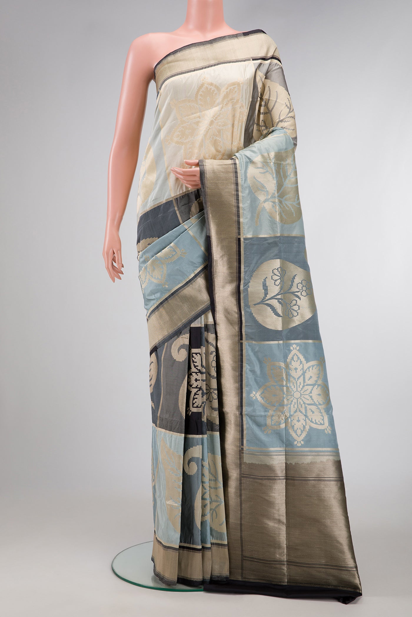 Black, Grey and Off White Color Banarasi Silk Saree with Zari Brocade on the body and Zari Border.  displayed on a mannequin