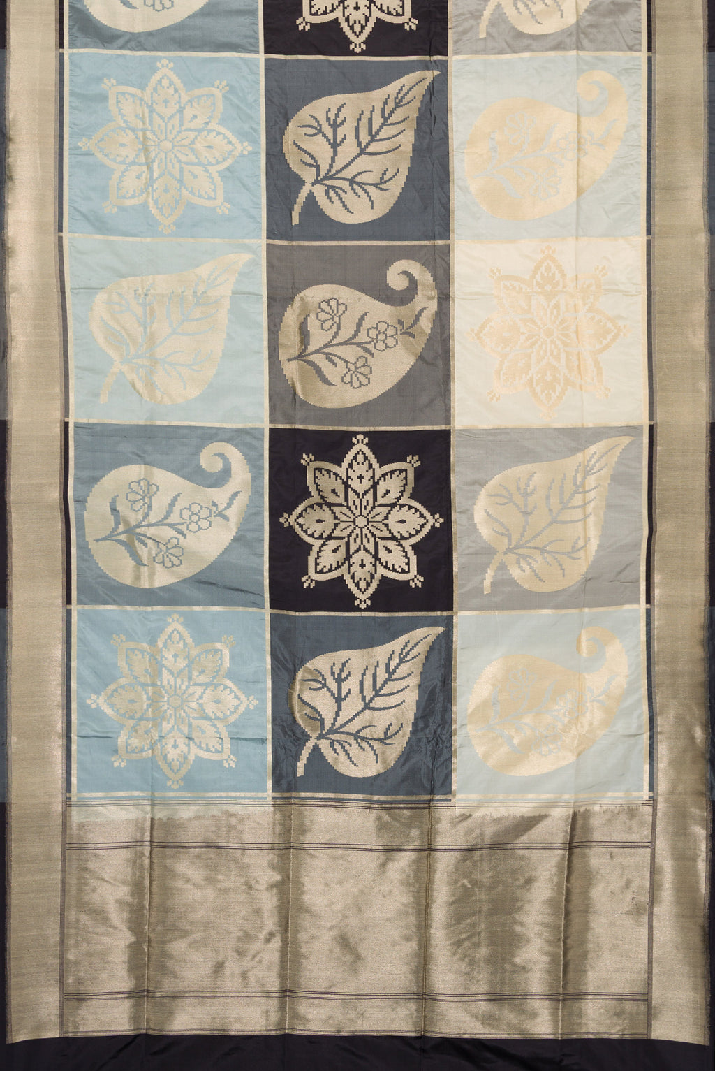 Flat view of Black, Grey and Off White Color Banarasi Silk Saree with Zari Brocade on the body and Zari Border. 