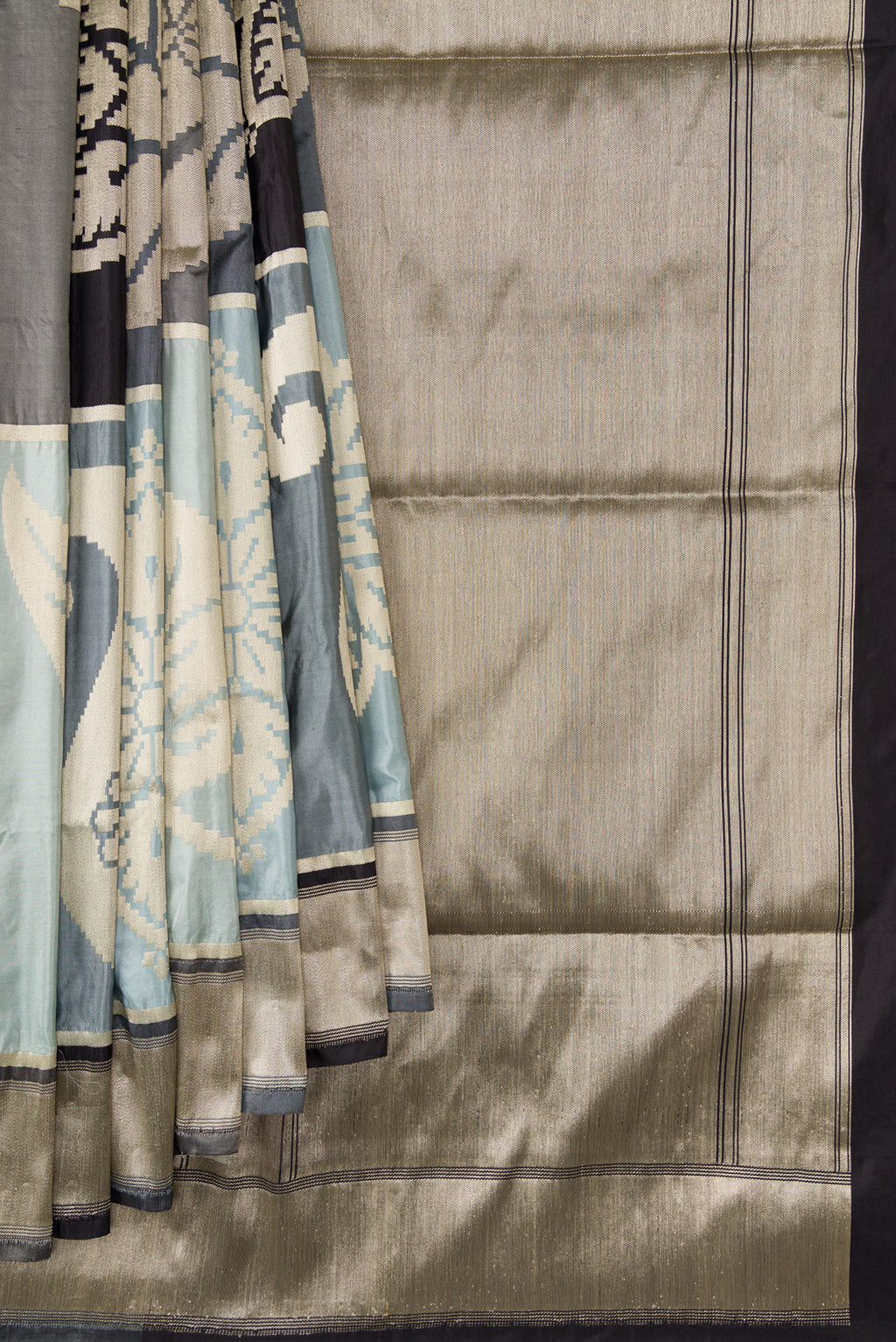 Pleats and pallu of Black, Grey and Off White Color Banarasi Silk Saree with Zari Brocade on the body and Zari Border. 