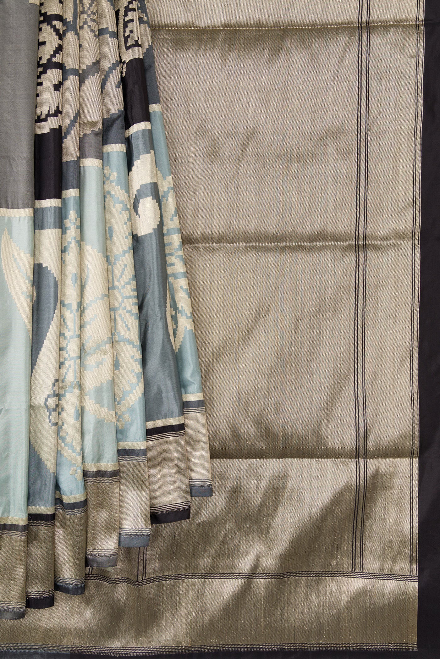 Pleats and pallu of Black, Grey and Off White Color Banarasi Silk Saree with Zari Brocade on the body and Zari Border. 