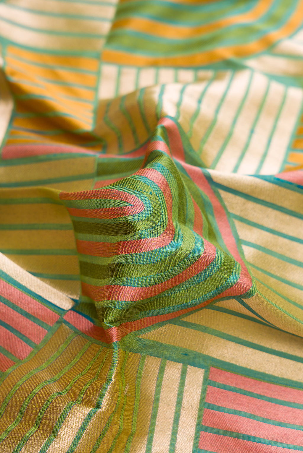 Close up of Green Dual Tone Banarasi Silk Saree with Zari Brocade on the body and Zari Border.  displaying folds