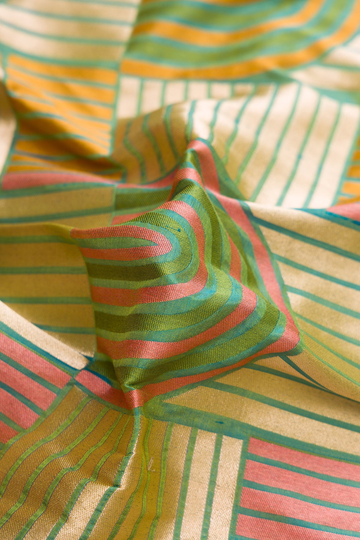 Close up of Green Dual Tone Banarasi Silk Saree with Zari Brocade on the body and Zari Border.  displaying folds