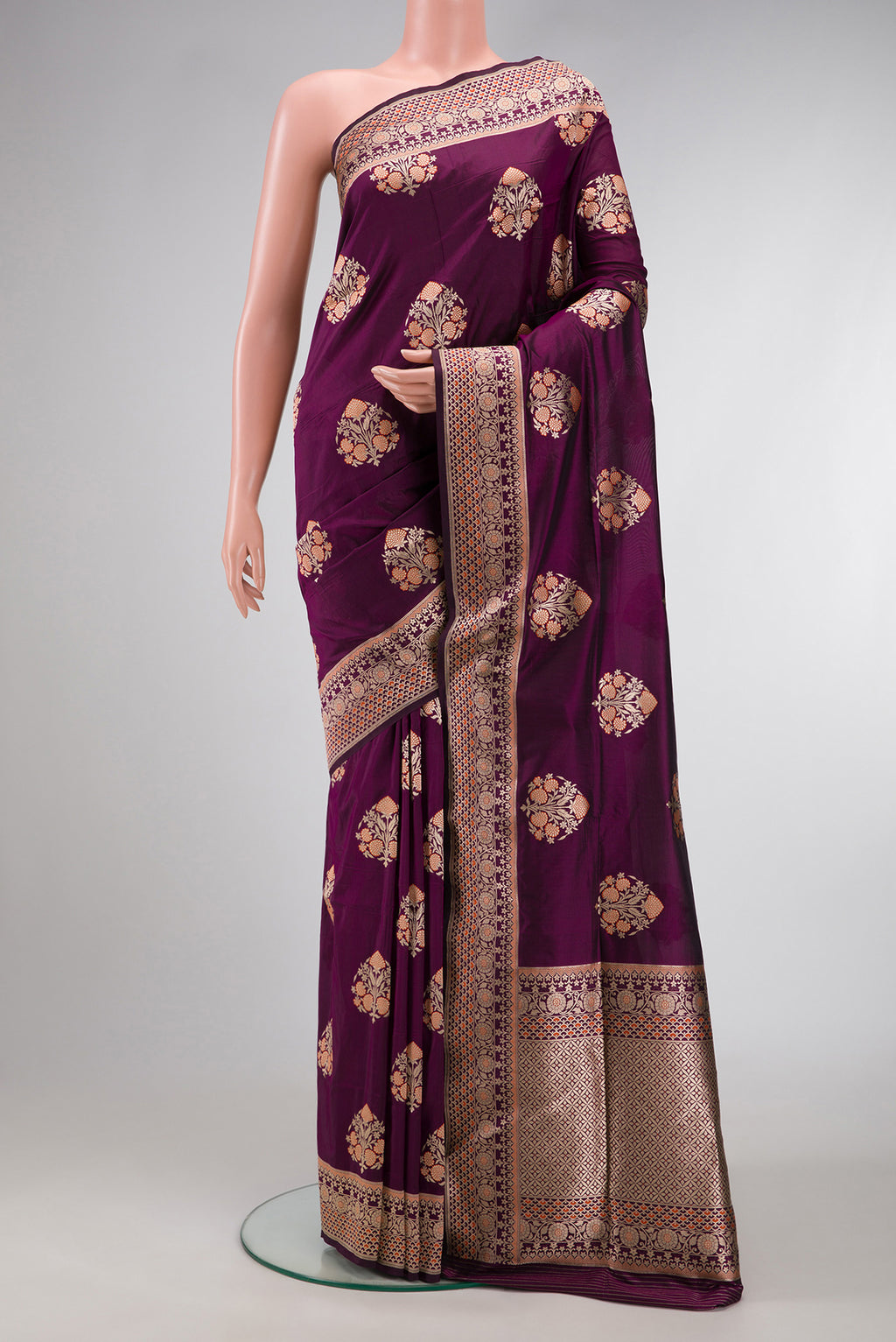 Burgundy Dual Tone Banarasi Silk Saree with Zari Butta on the body and Fancy Border.  displayed on a mannequin
