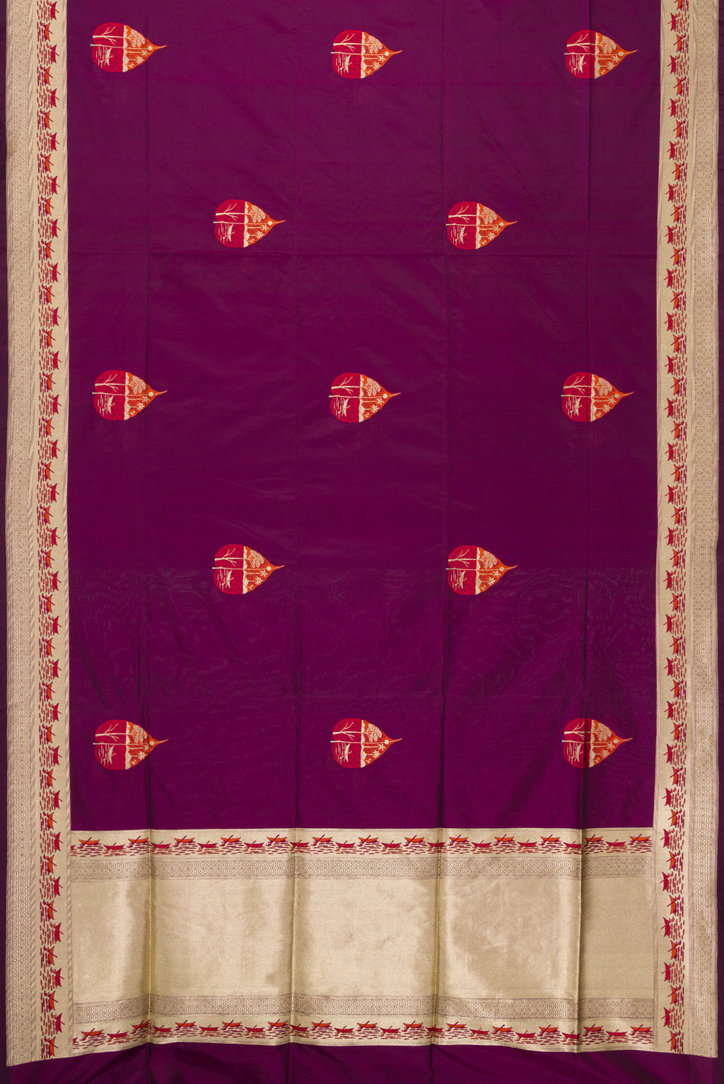 Flat view of Burgundy Dual Tone Banarasi Silk Saree with Zari And Thread Butta on the body and Fancy Border. 