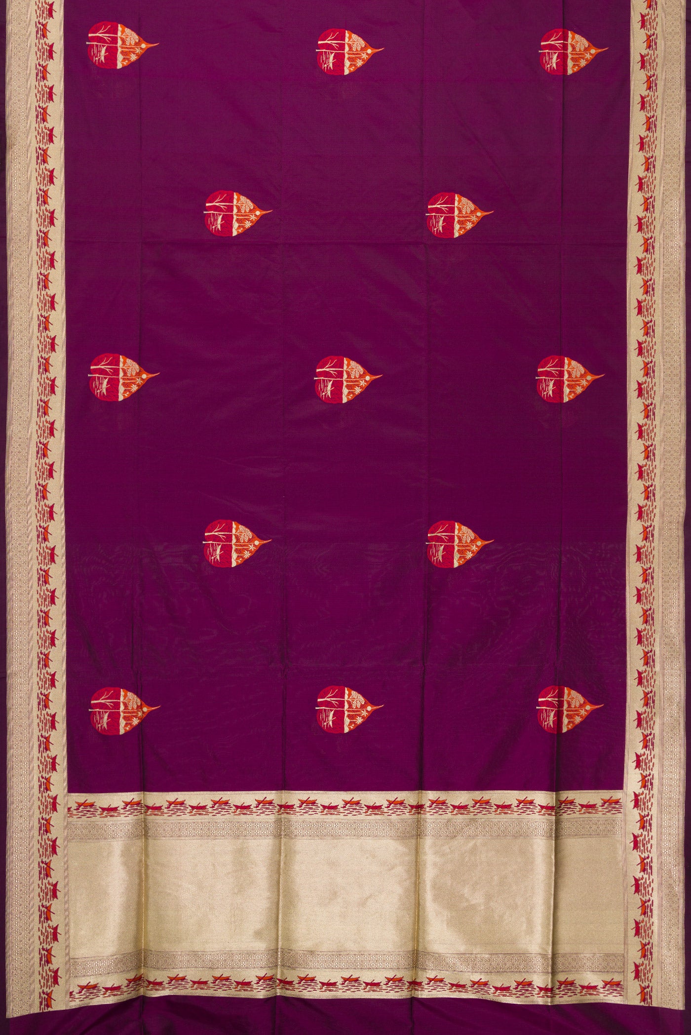 Flat view of Burgundy Dual Tone Banarasi Silk Saree with Zari And Thread Butta on the body and Fancy Border. 