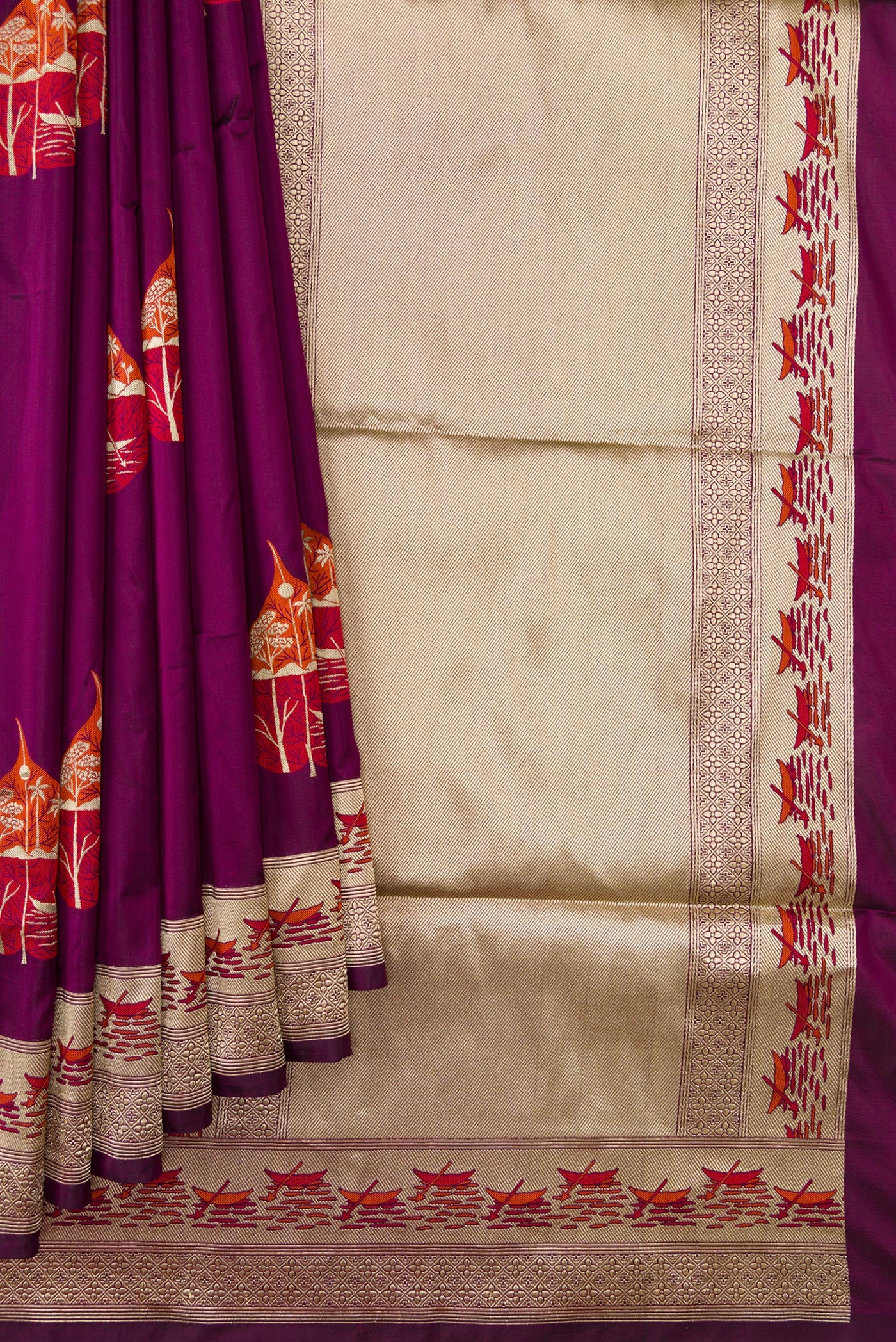 Pleats and pallu of Burgundy Dual Tone Banarasi Silk Saree with Zari And Thread Butta on the body and Fancy Border. 