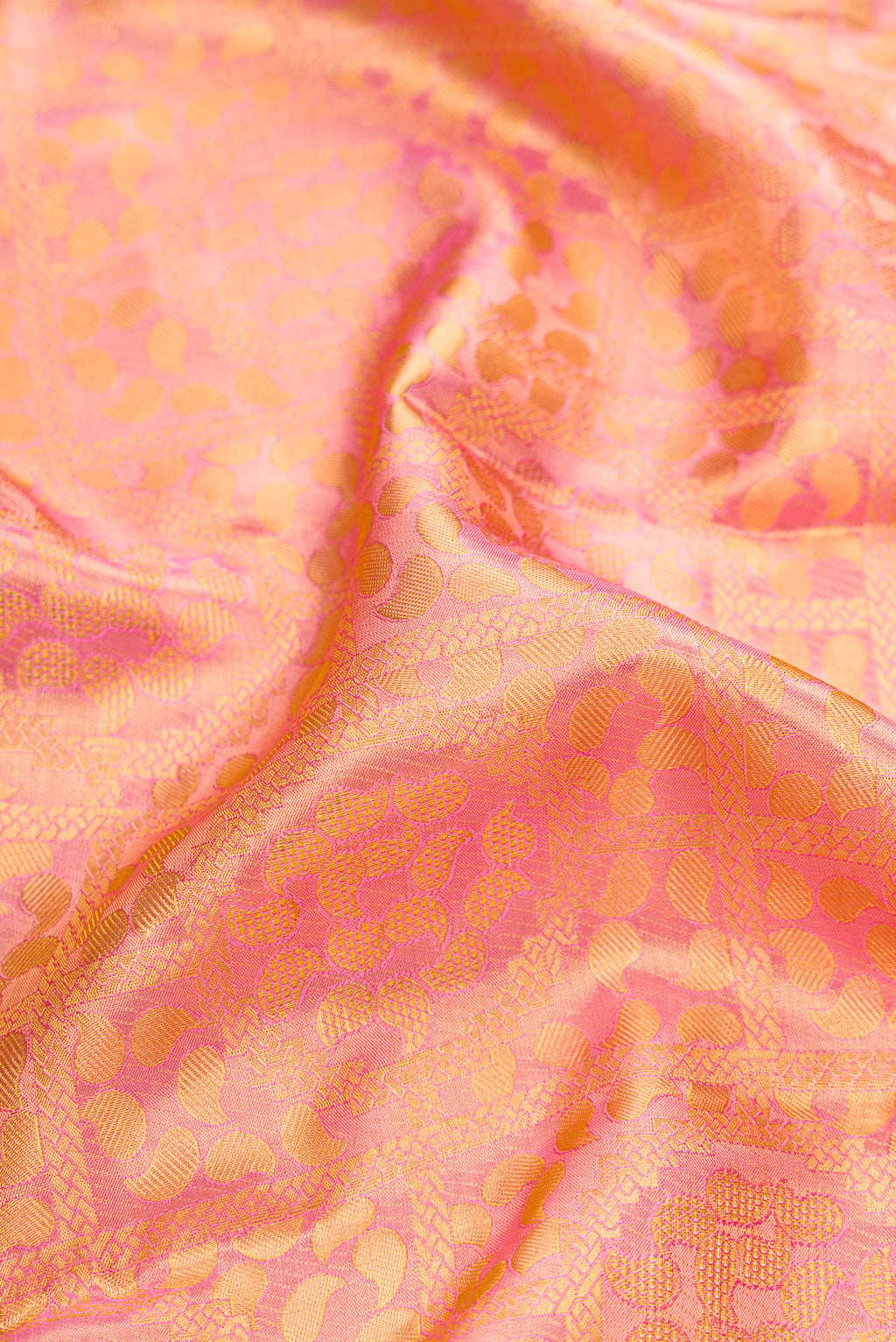 Close up of Rose pink Dual Tone Kanchipuram Tissue Silk Saree with Zari Brocade on the body and Zari Border.  displaying folds