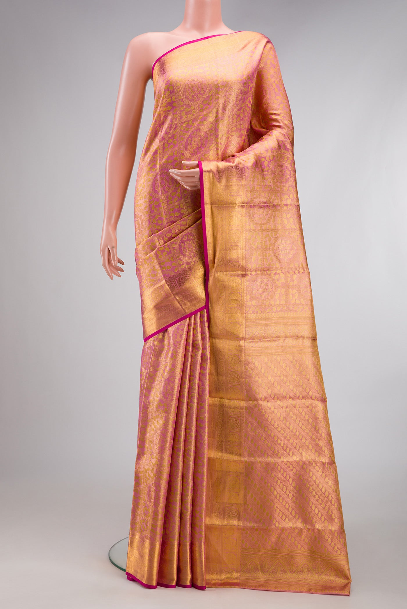 Rose pink Dual Tone Kanchipuram Tissue Silk Saree with Zari Brocade on the body and Zari Border.  displayed on a mannequin
